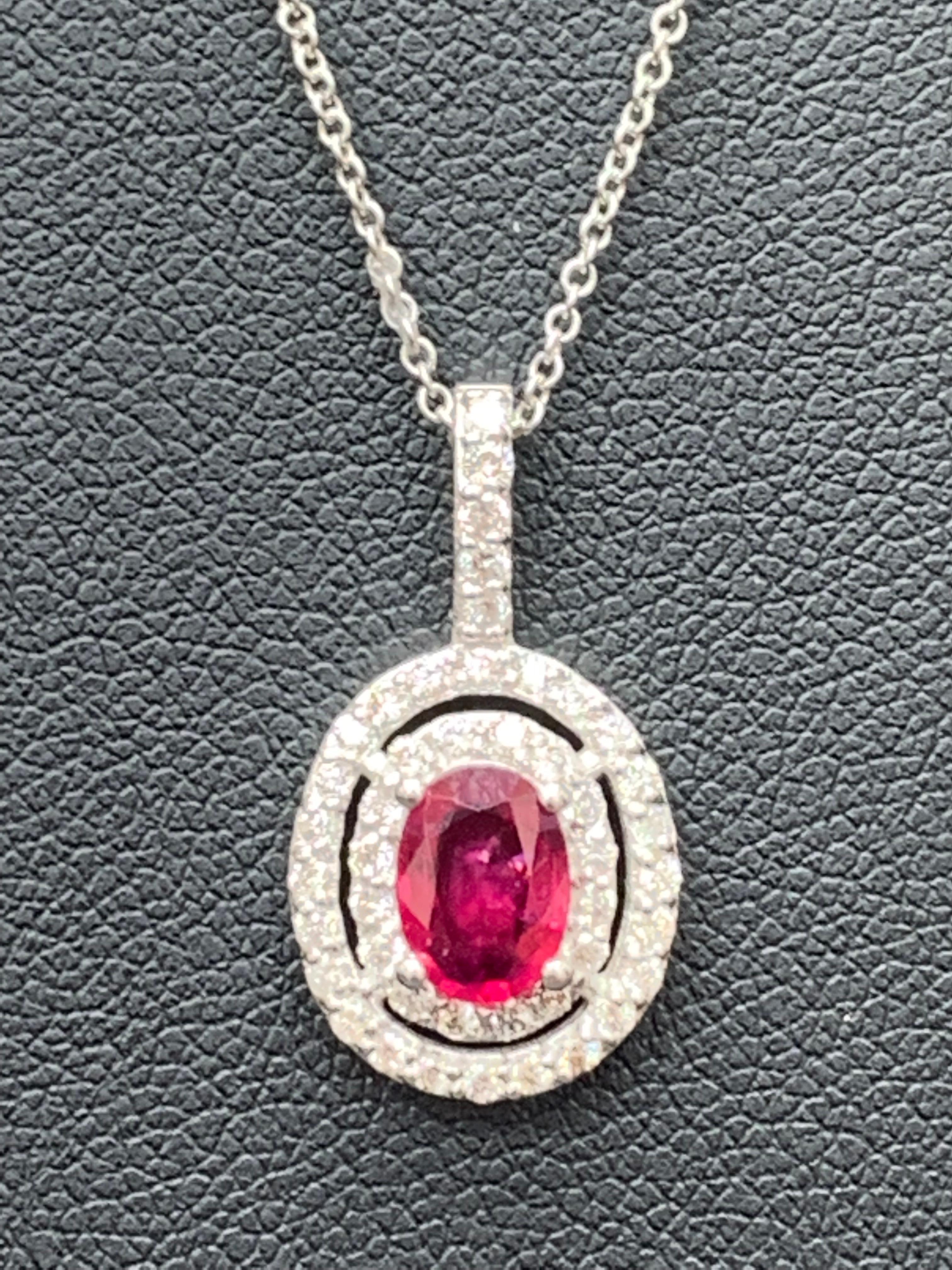 Modern Grandeur 0.81 Carat Oval Cut Ruby and Diamond Pendant in 14K White Gold For Sale