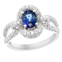 Grandeur Anillo de compromiso de oro blanco de 18 quilates con diamante zafiro azul ovalado de 0,94 quilates