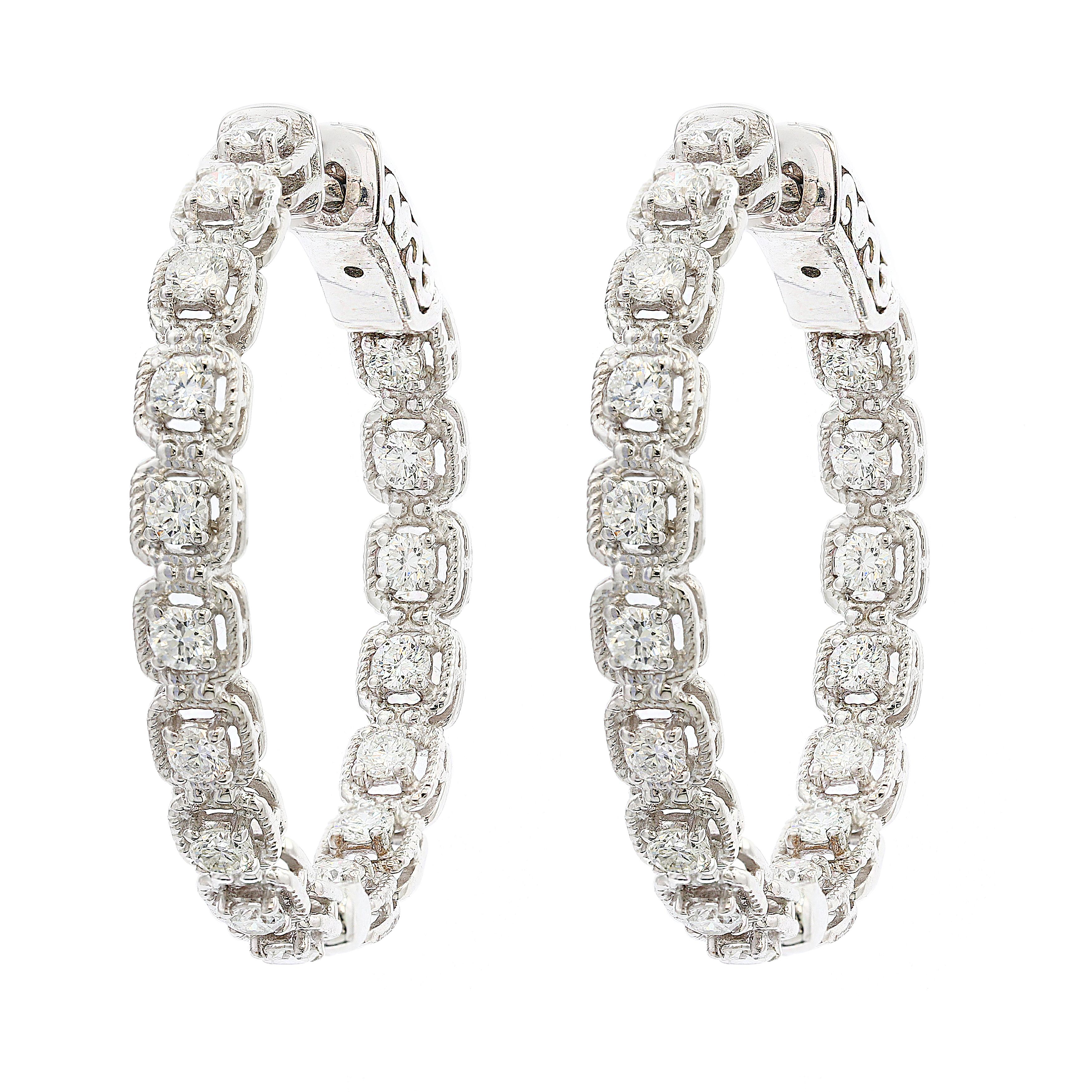 Showcasing a row of round brilliant diamonds, set in a stylish hoop design. With this design, it will sit comfortably and perfectly on the ear. Made in 14k white gold. 34 Diamonds weigh 1.04 carats total.
Hoop Earrings are 1 inch approx.
 
All