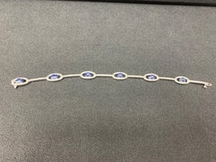2.46 Carat Oval Blue Sapphire and Diamond Encrusted Tennis Bracelet