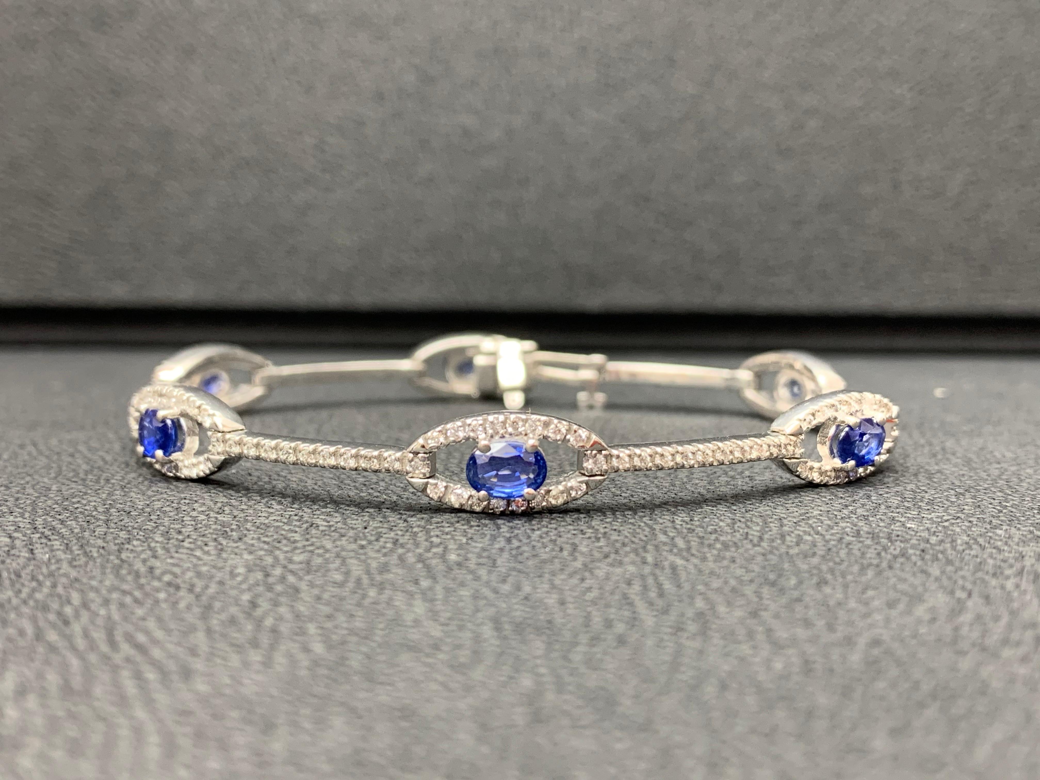 2.46 Carat Oval Blue Sapphire and Diamond Encrusted Tennis Bracelet In New Condition For Sale In NEW YORK, NY