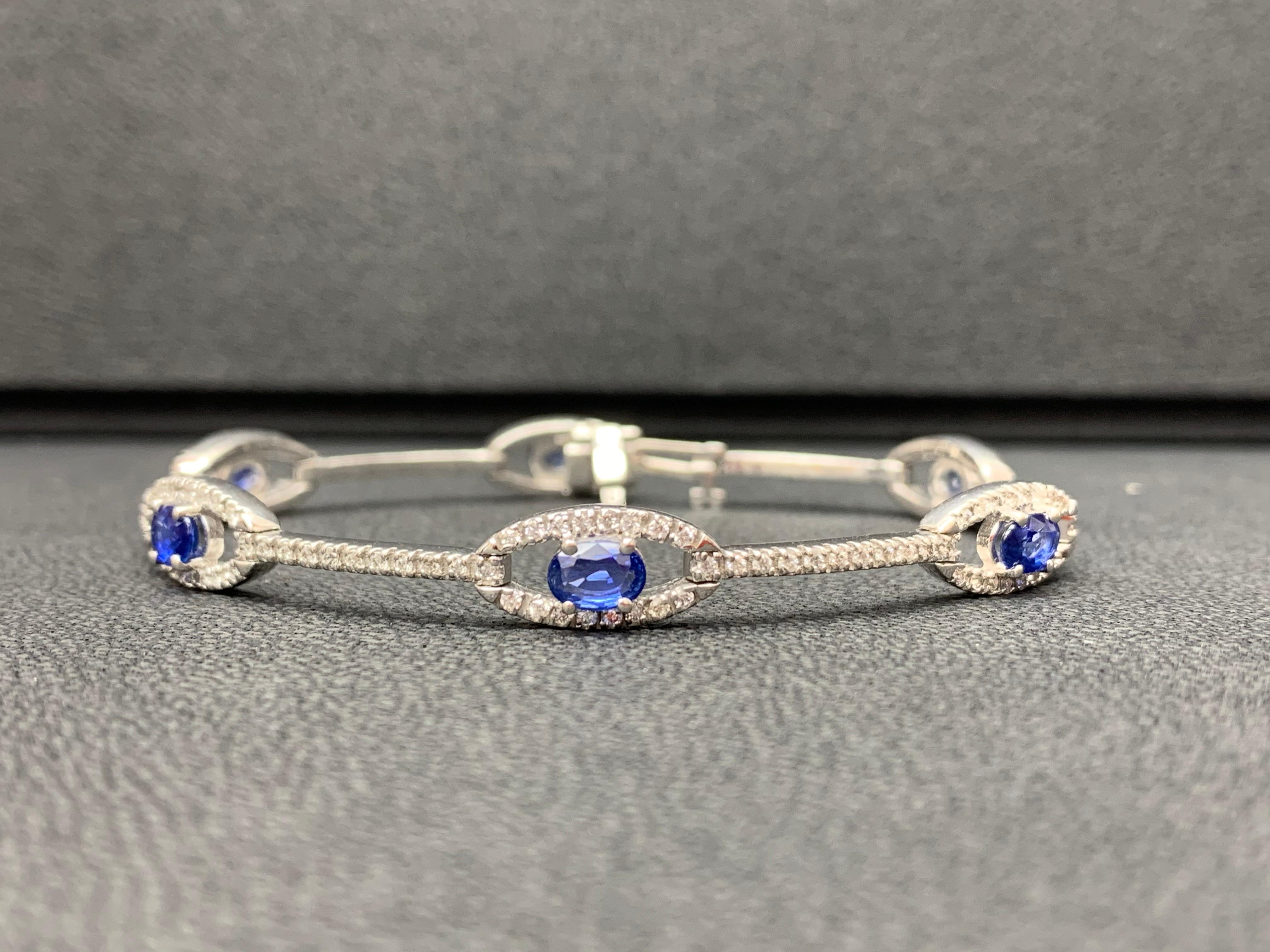 Women's 2.46 Carat Oval Blue Sapphire and Diamond Encrusted Tennis Bracelet For Sale