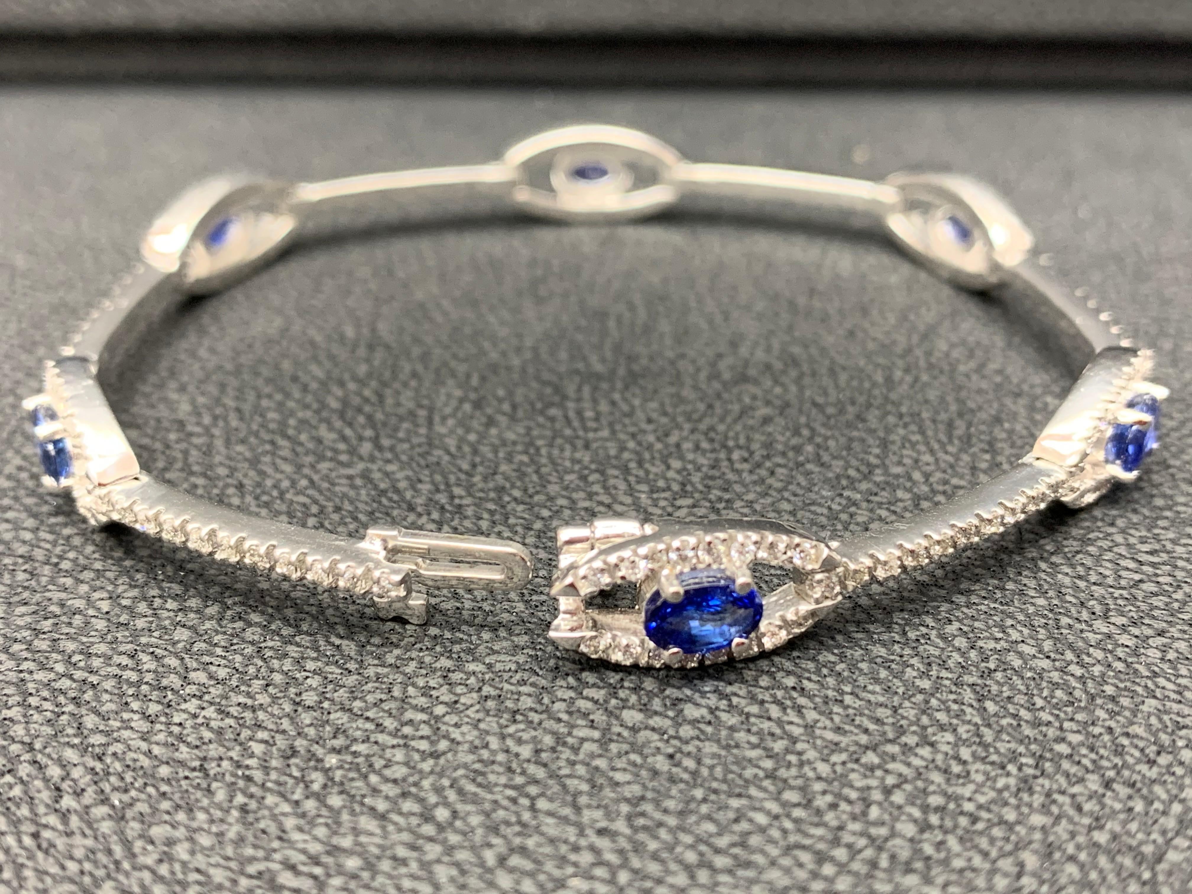 2.46 Carat Oval Blue Sapphire and Diamond Encrusted Tennis Bracelet For Sale 1