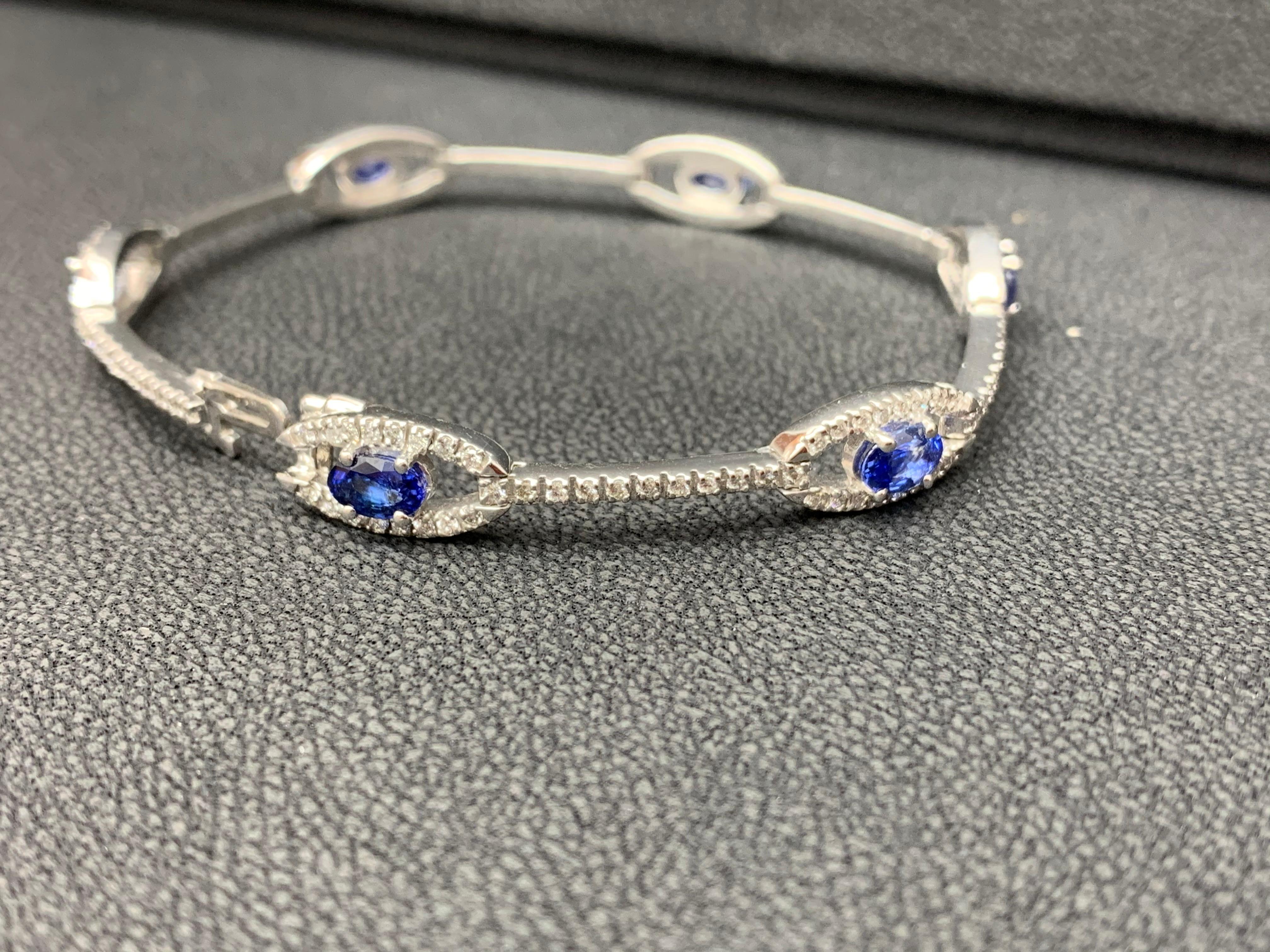 2.46 Carat Oval Blue Sapphire and Diamond Encrusted Tennis Bracelet For Sale 2