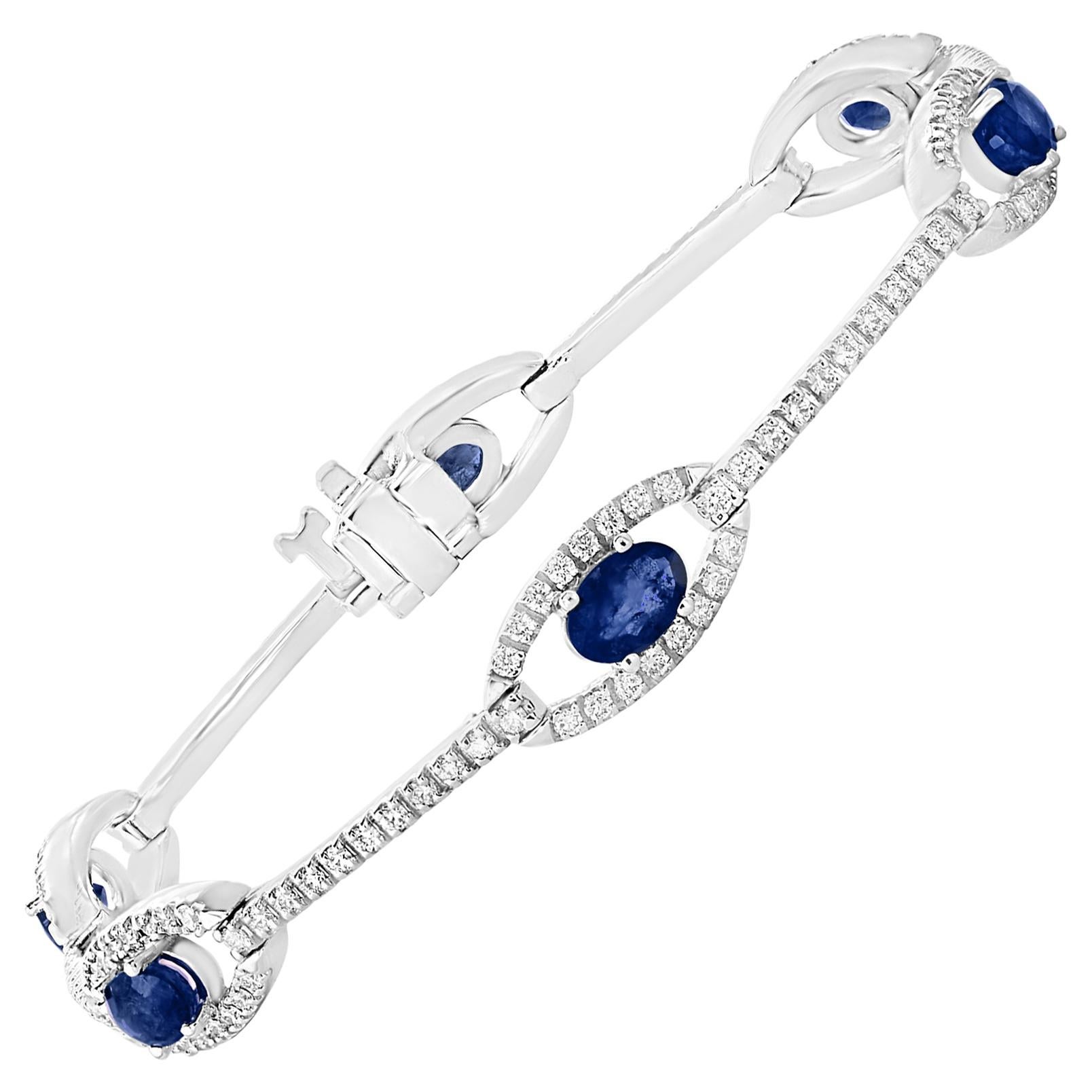 2.46 Carat Oval Blue Sapphire and Diamond Encrusted Tennis Bracelet For Sale