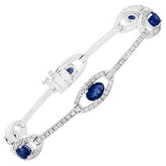 2.46 Carat Oval Blue Sapphire and Diamond Encrusted Tennis Bracelet