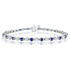 Bracelet Grandeur en or blanc 14 carats avec saphir bleu rond de 2,65 carats et diamants