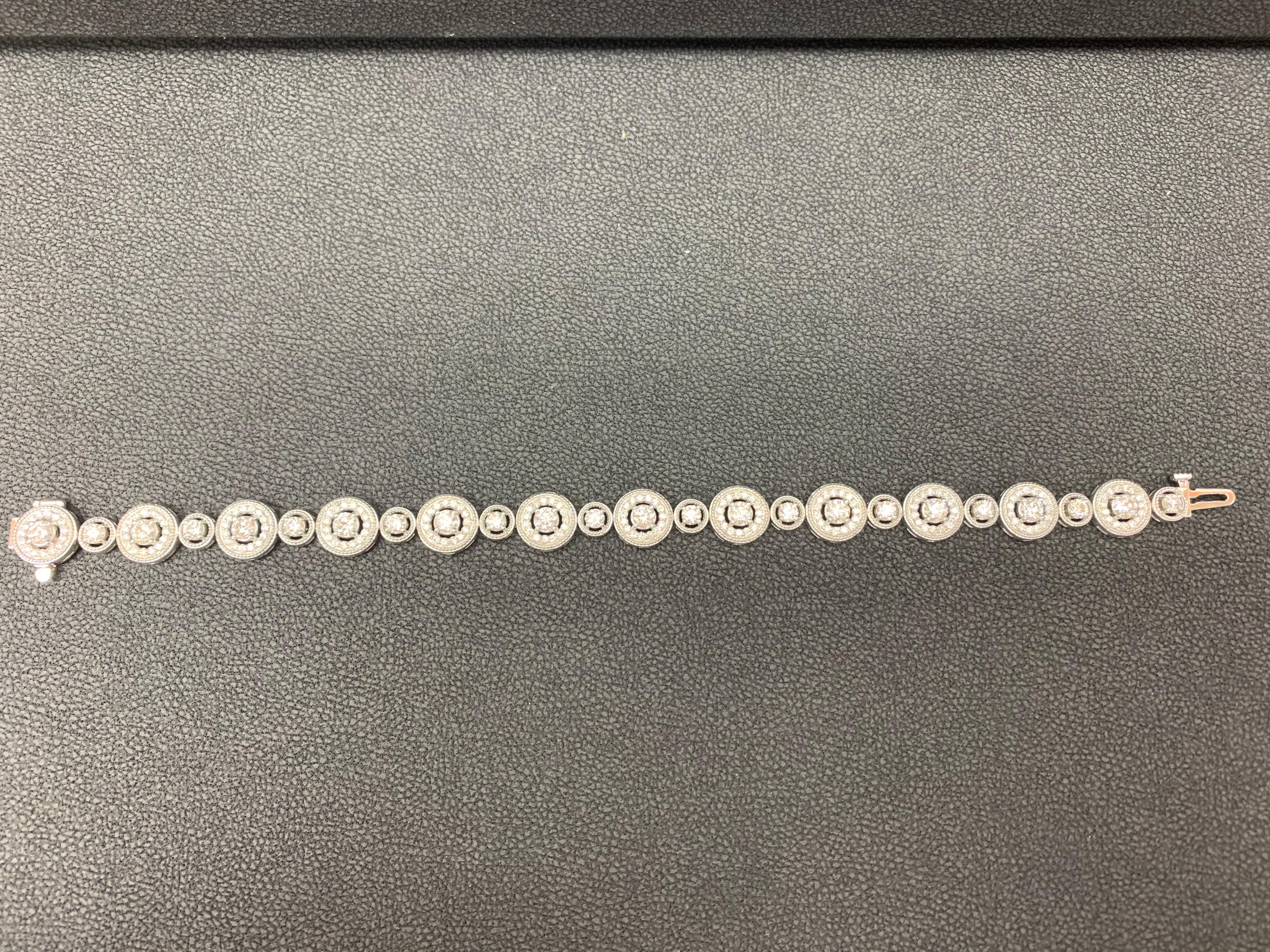This gorgeous bracelet features 12 Big Round Brilliant Diamonds weighing 2.87 carats , 12 Small Round Brilliant Diamonds weighing 1.21 carats total. Each Big Diamond  is surrounded by a single row of 180 small round diamonds weighing 1.44 carats