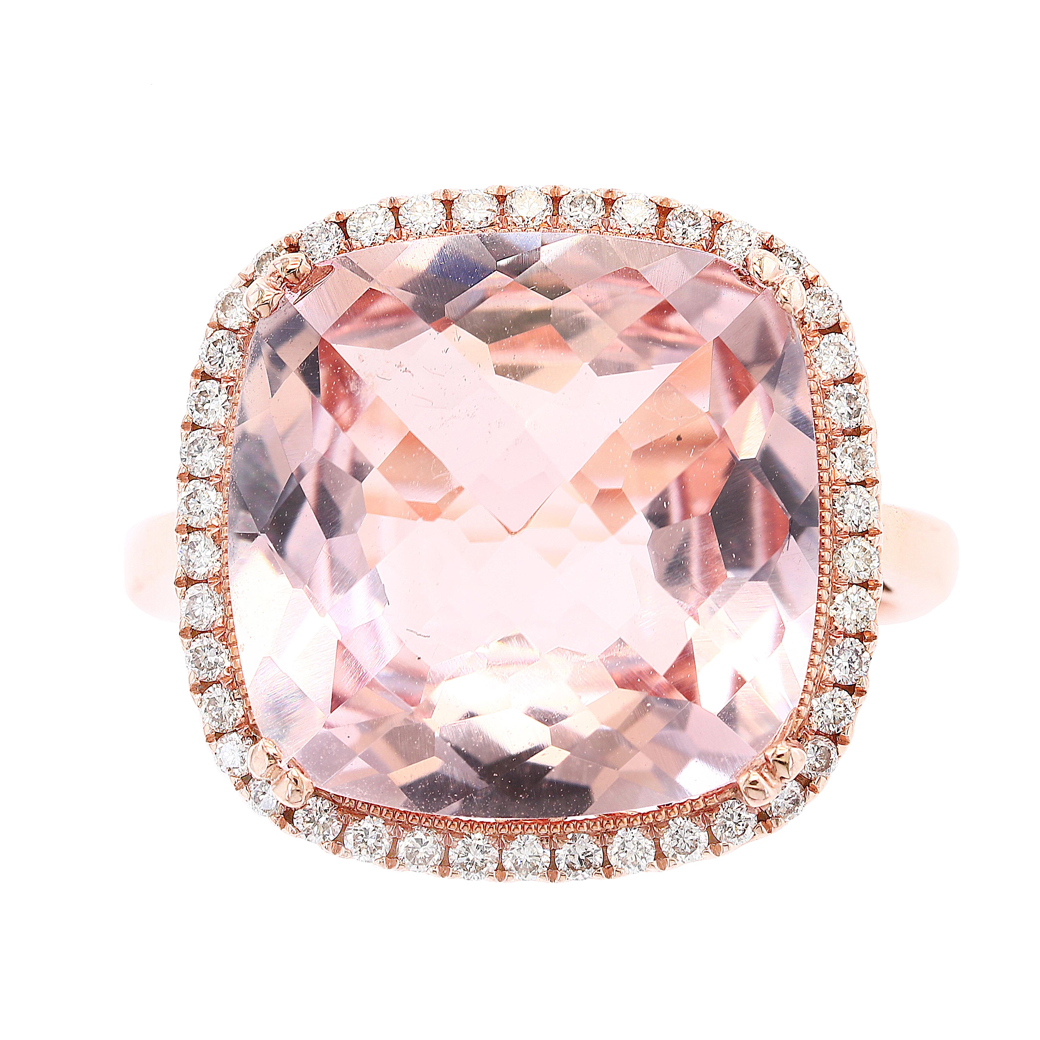 Featuring  5.58 carat Cushion Cut Morganite, surrounded by one row of 52 round brilliant diamonds. Set in a 14K mounting accented with diamonds. Total weight of diamonds is 0.86 carats.

Size 6.5 US (Sizable). One of a Kind  piece.
All diamonds are