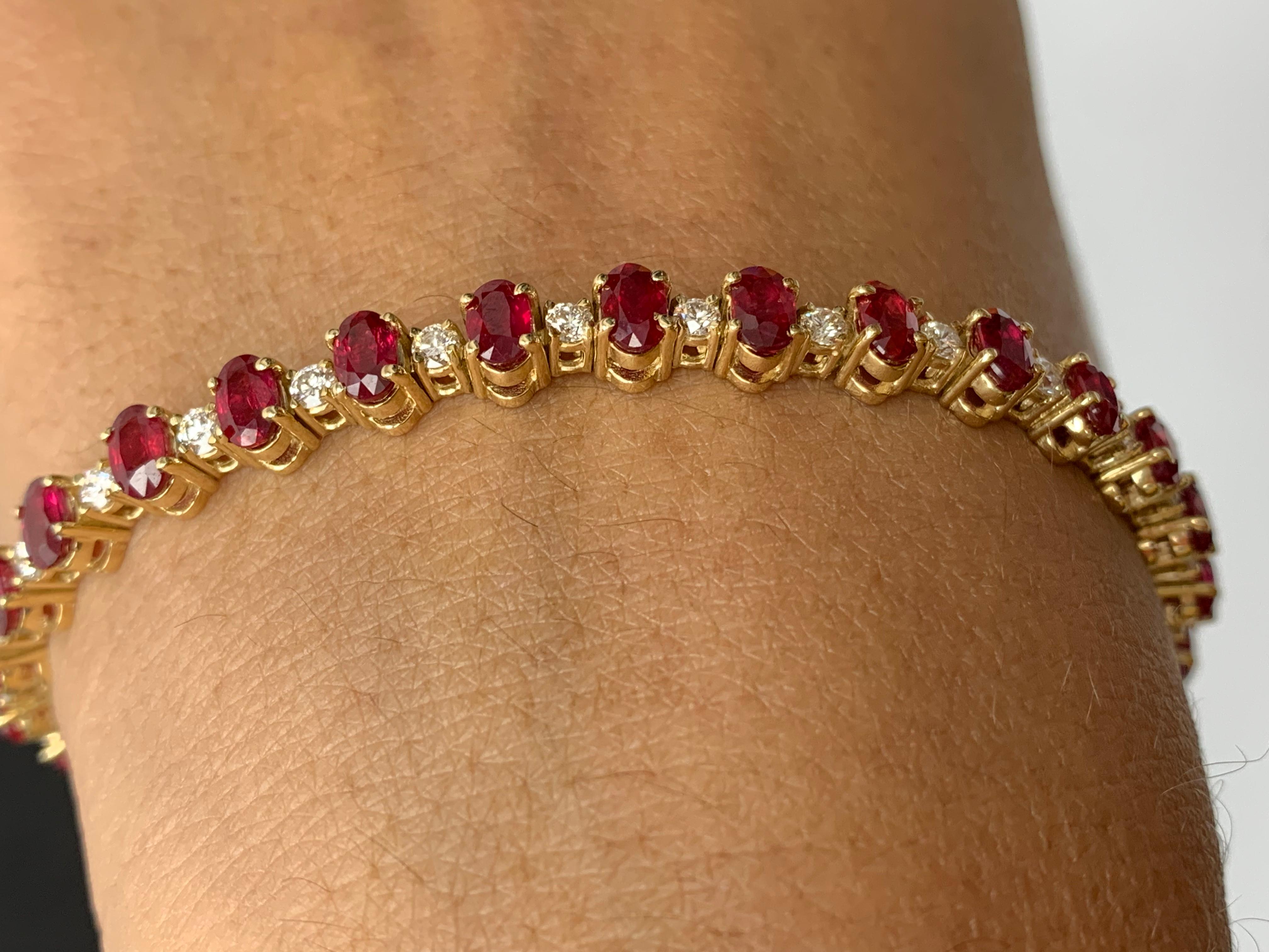 A stunning bracelet set with 30 Vibrant oval cut Red Rubies weighing 9.27 carats total. Alternating these rubies are 30 sparkling round diamonds weighing 1.48 carats total. Set in polished 14k yellow gold. Double lock mechanism for maximum security.