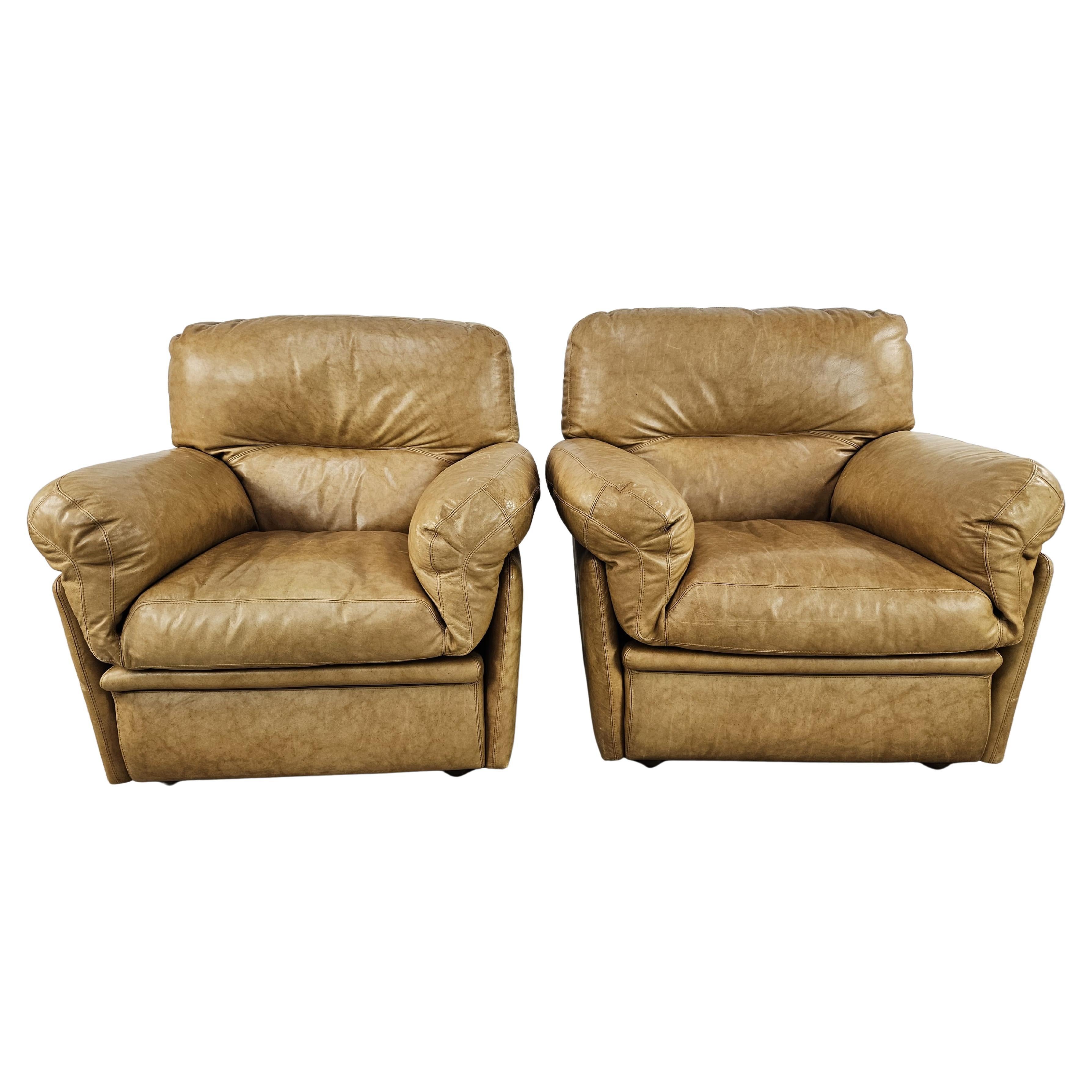 Large upholstered camel-colored leather armchairs from the 1970s