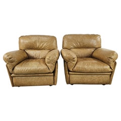 Large upholstered camel-colored leather armchairs from the 1970s