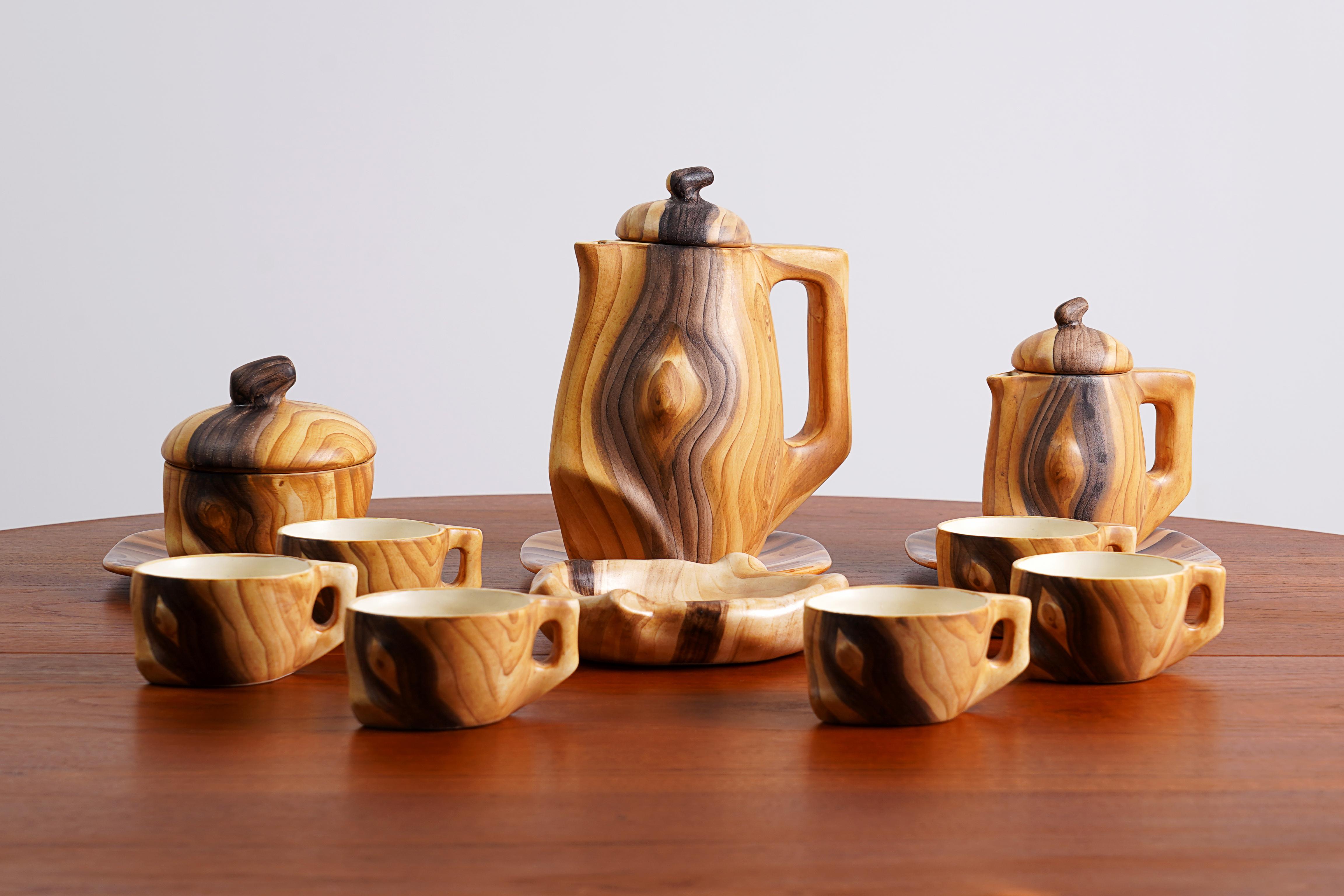 'Faux Bois' ceramic Tea sets of 13 pieces by Grandjean Jourdan, Vallauris France 1950s / 1960s.

Some of the pieces are marked Vallauris underneath.

The set is composed of 6 cups / 2 jars / 1 dish / 1 sugar bowl / 3 plates

Atelier Grandjean