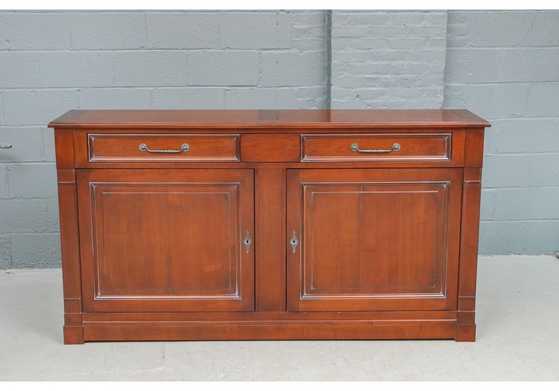 A large and superbly made Server Cabinet from Grange with excellent proportions and workmanship. Very architectural and incredibly useful with a handsome sectioned top, two large drawers surmounting a double-door storage space, each side having an