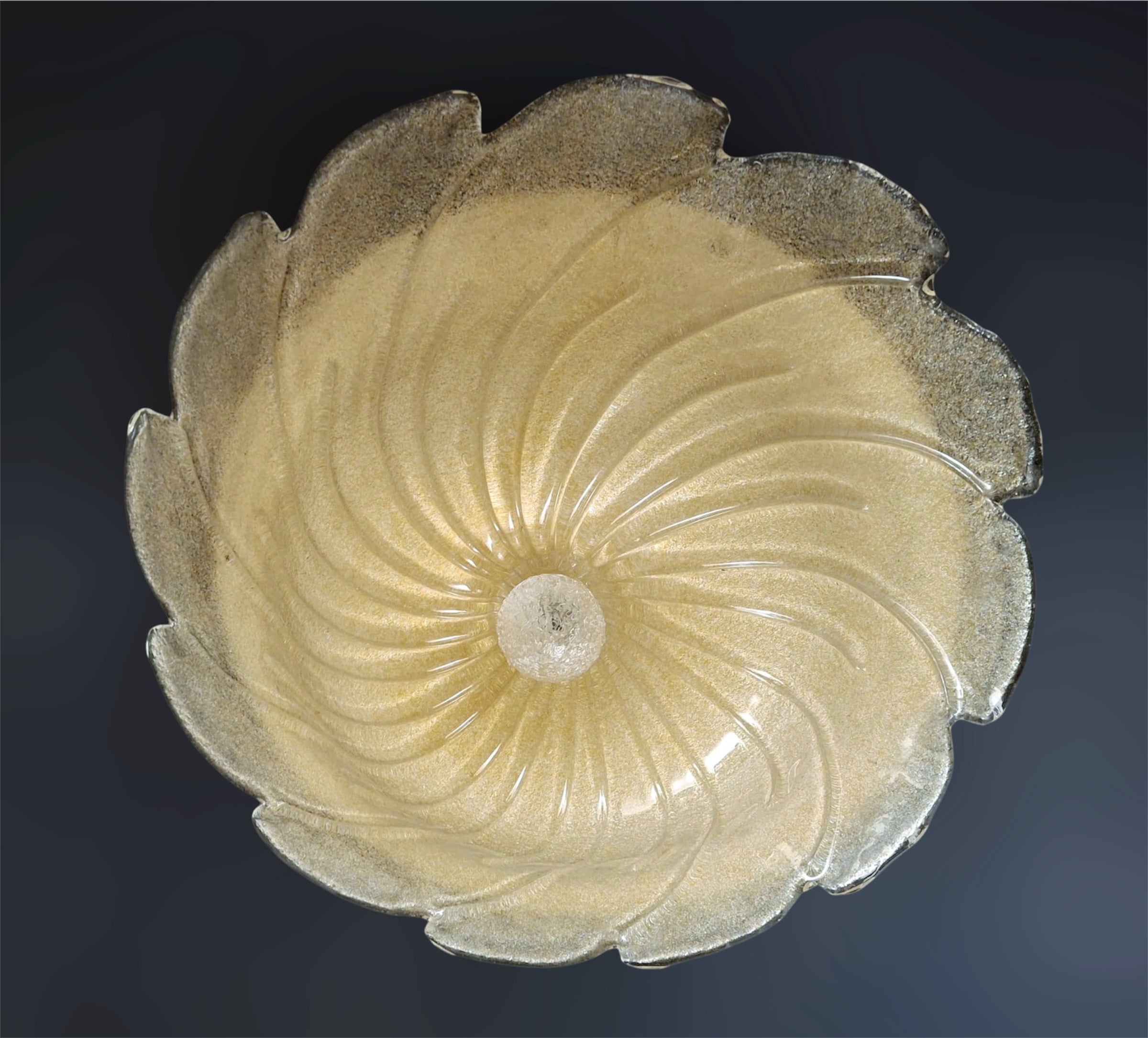 Italian flush mount with a Murano glass diffuser hand blown in amber Graniglia technique to produce granular texture/ Made in Italy in the style of Barovier e Toso, circa 1960s
Measures: diameter 21.5 inches, height 6 inches
2 lights / E26 or E27