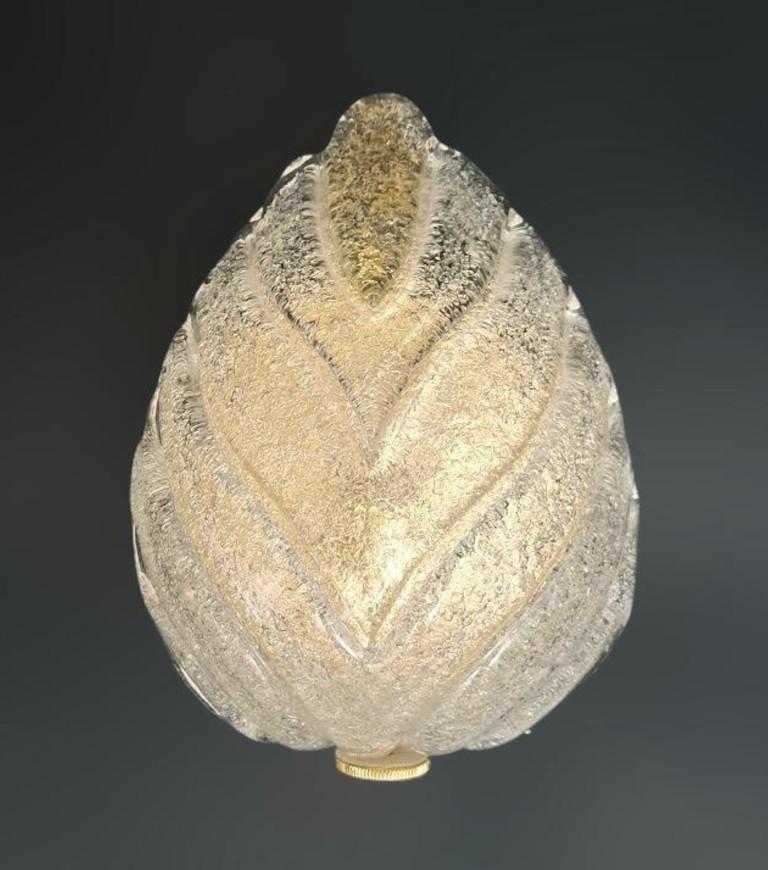 Italian wall light with a Murano glass leaf hand blown in Graniglia technique to produce granular textured effect, mounted on gold finish frame / Made in Italy circa 1960s
Measures: Height 10 inches, width 7 inches, depth 4 inches
1 light / E12 or