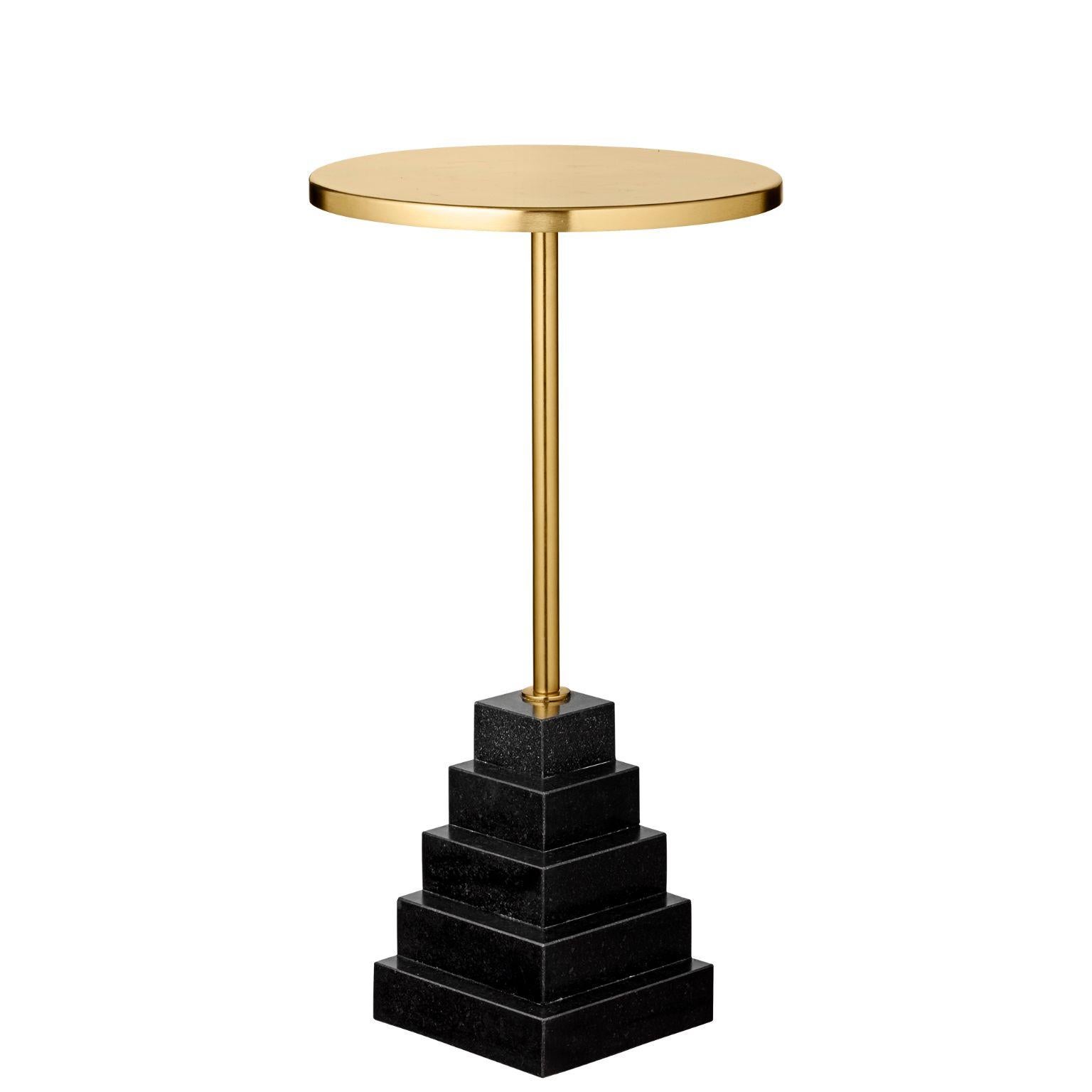 Granite and steel gold side table
Dimensions: Ø 32 x H 55 CM
Materials: Steel, granite base

The unique shape will make them stand out in any room in the home and truly appear as pieces of art. The tables are made of a foot in marble or granite