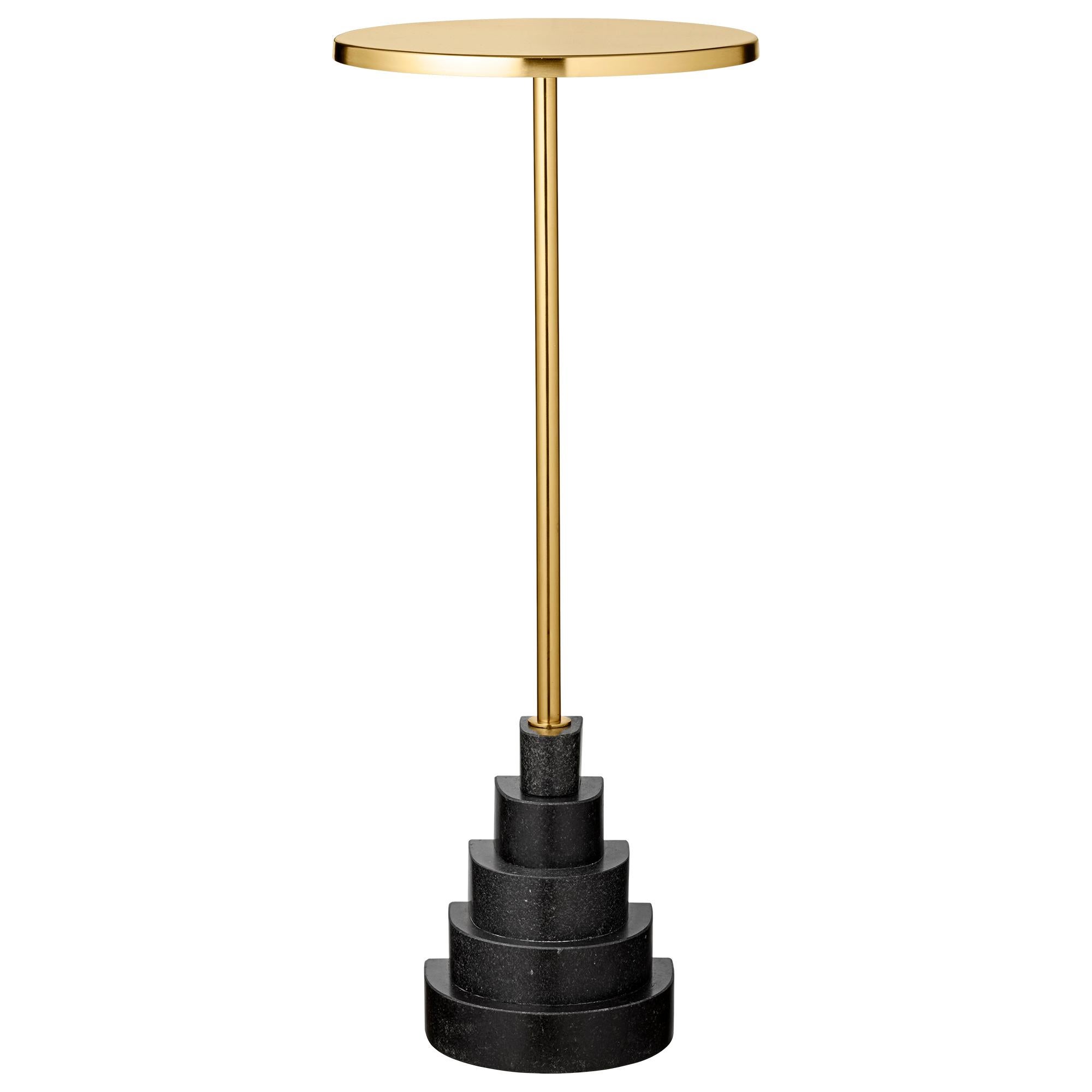 Granite and steel gold side table
Dimensions: Ø 32 x H 78 cm
Materials: Steel, granite base

The unique shape will make them stand out in any room in the home and truly appear as pieces of art. The tables are made of a foot in marble or granite in a