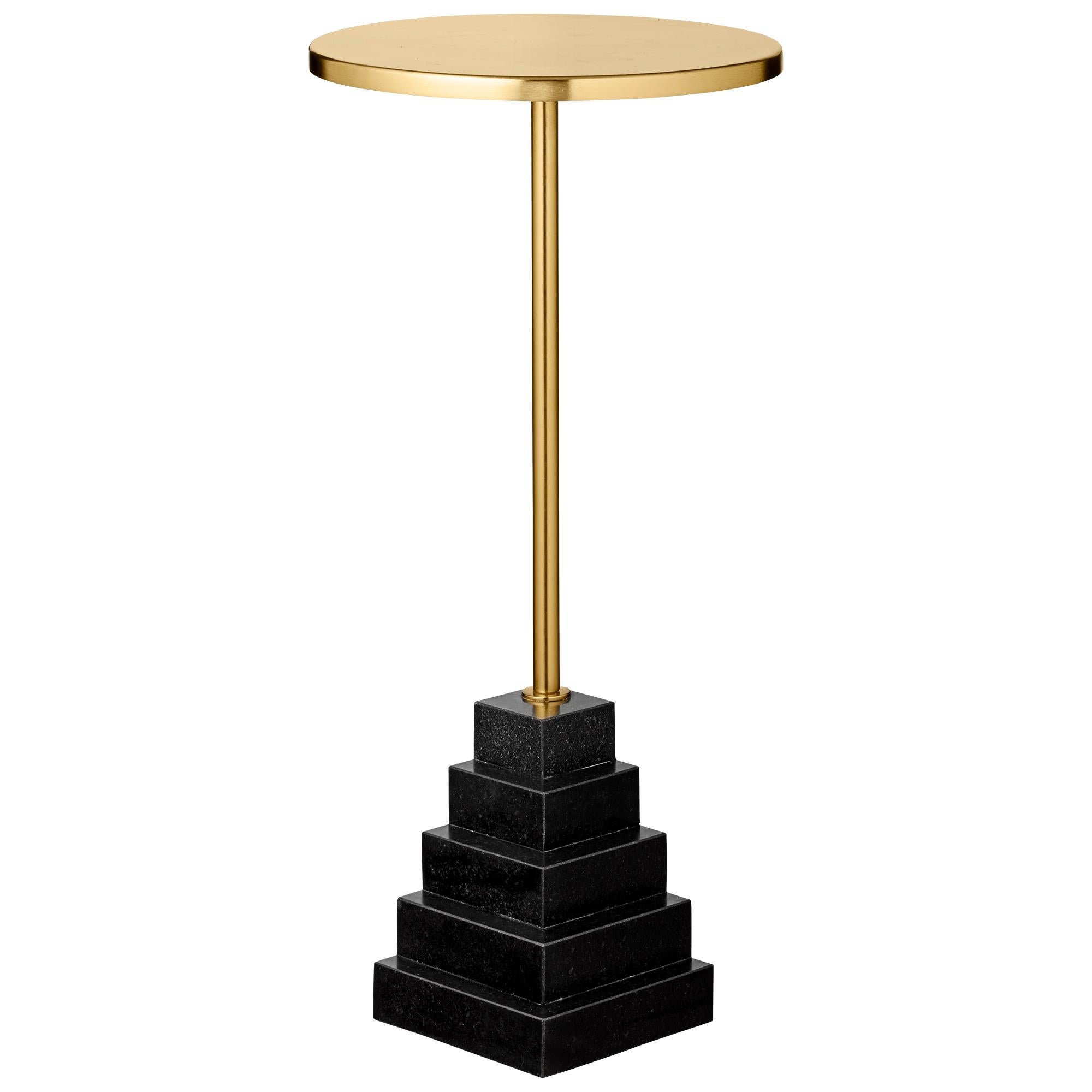 Granite and steel gold side table
Dimensions: Ø 32 x H 67 CM
Materials: Steel, granite base

The unique shape will make them stand out in any room in the home and truly appear as pieces of art. The tables are made of a foot in marble or granite in a