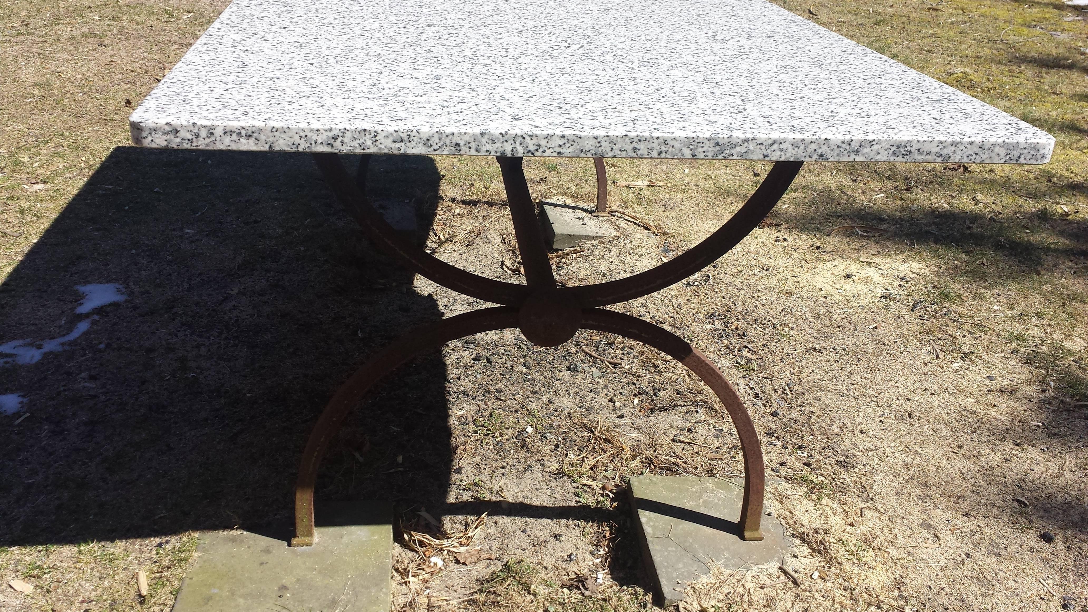 Granite and wrought iron outdoor table.