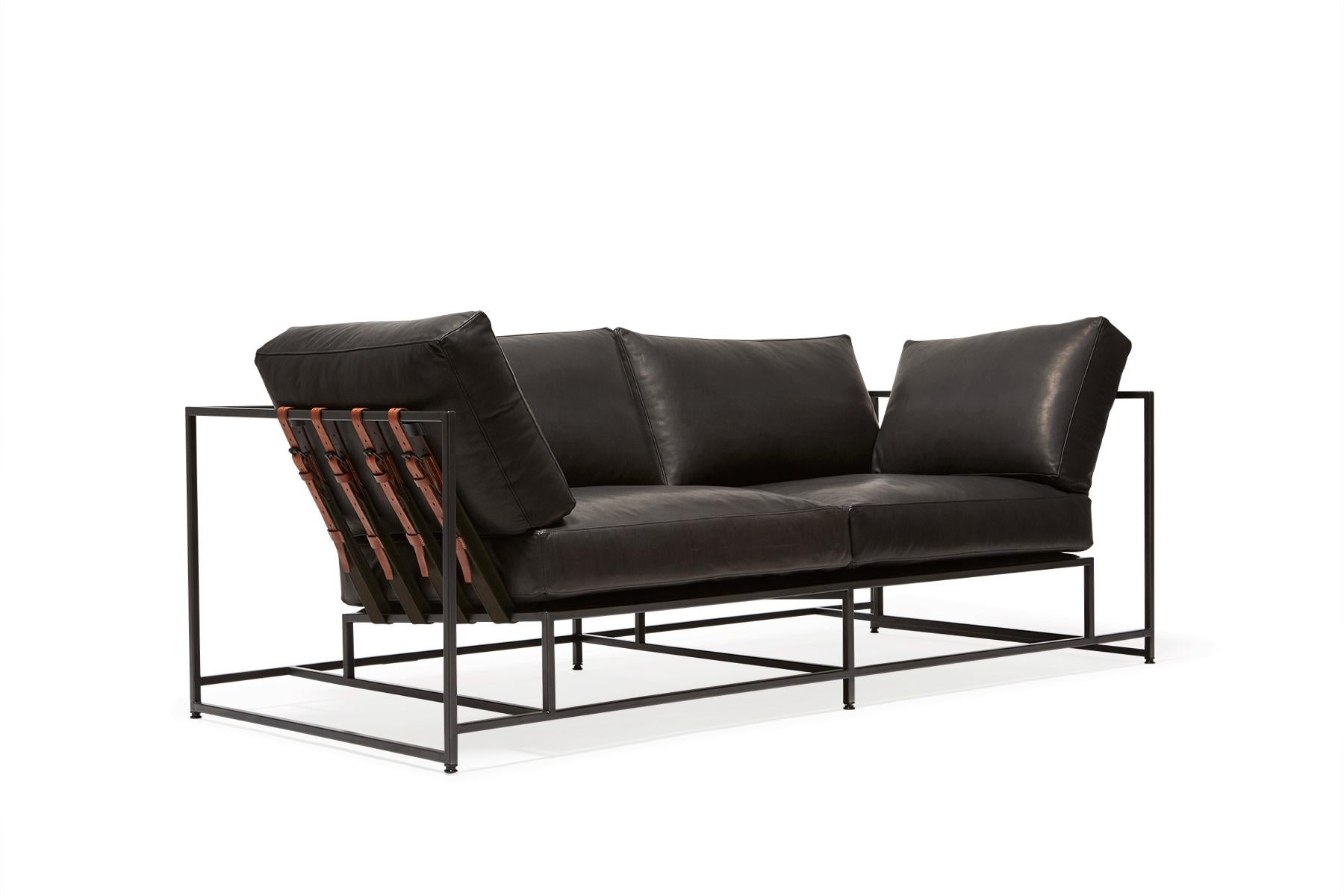 The Inheritance Two Seat Sofa by Stephen Kenn is as comfortable as it is unique. The design features an exposed construction composed of three elements - a steel frame, plush upholstery, and supportive belts. The deep seating area is perfect for a