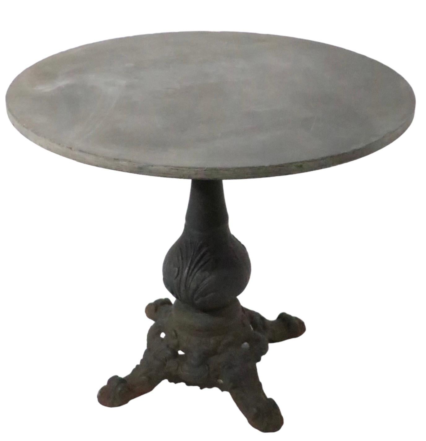 American Granite Top Cast Iron Base French Style Cafe Bistro Garden Table c 1920 - 1950s For Sale