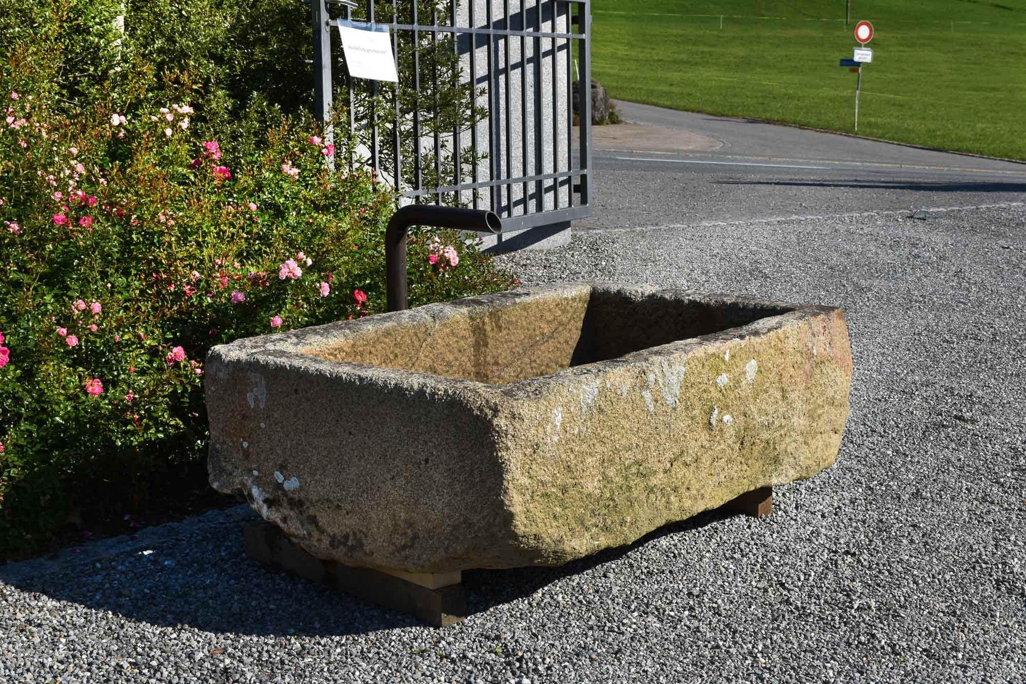 This small granite trough has a nice patina and is in a very good condition.
It looks wonderful in the garden and around flowers. You will enjoy the sound, which the water makes.
 