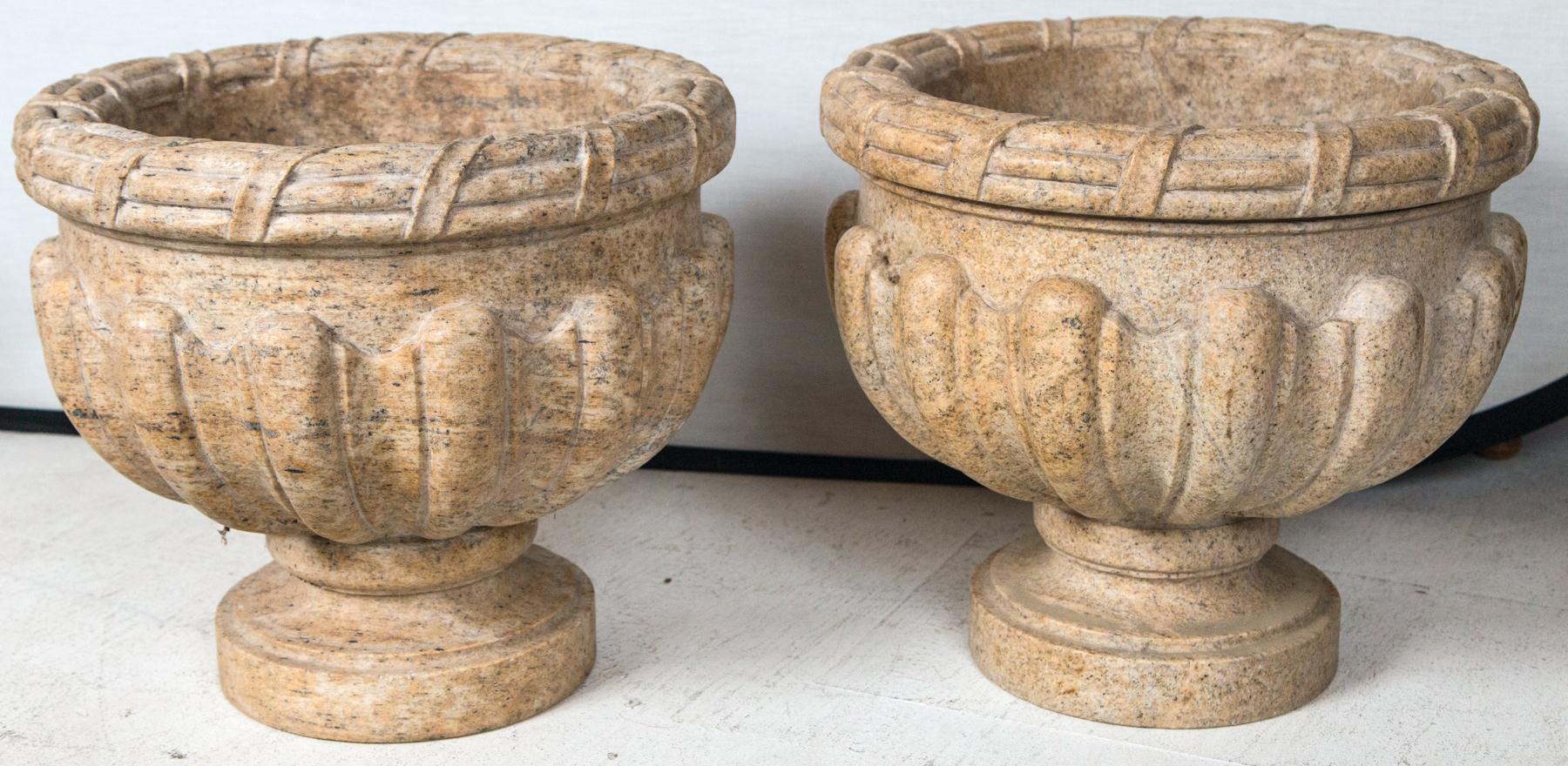Pair of superb miPair of superb midcentury carved, polished granite urnes.d-century carved, polished granite urnes