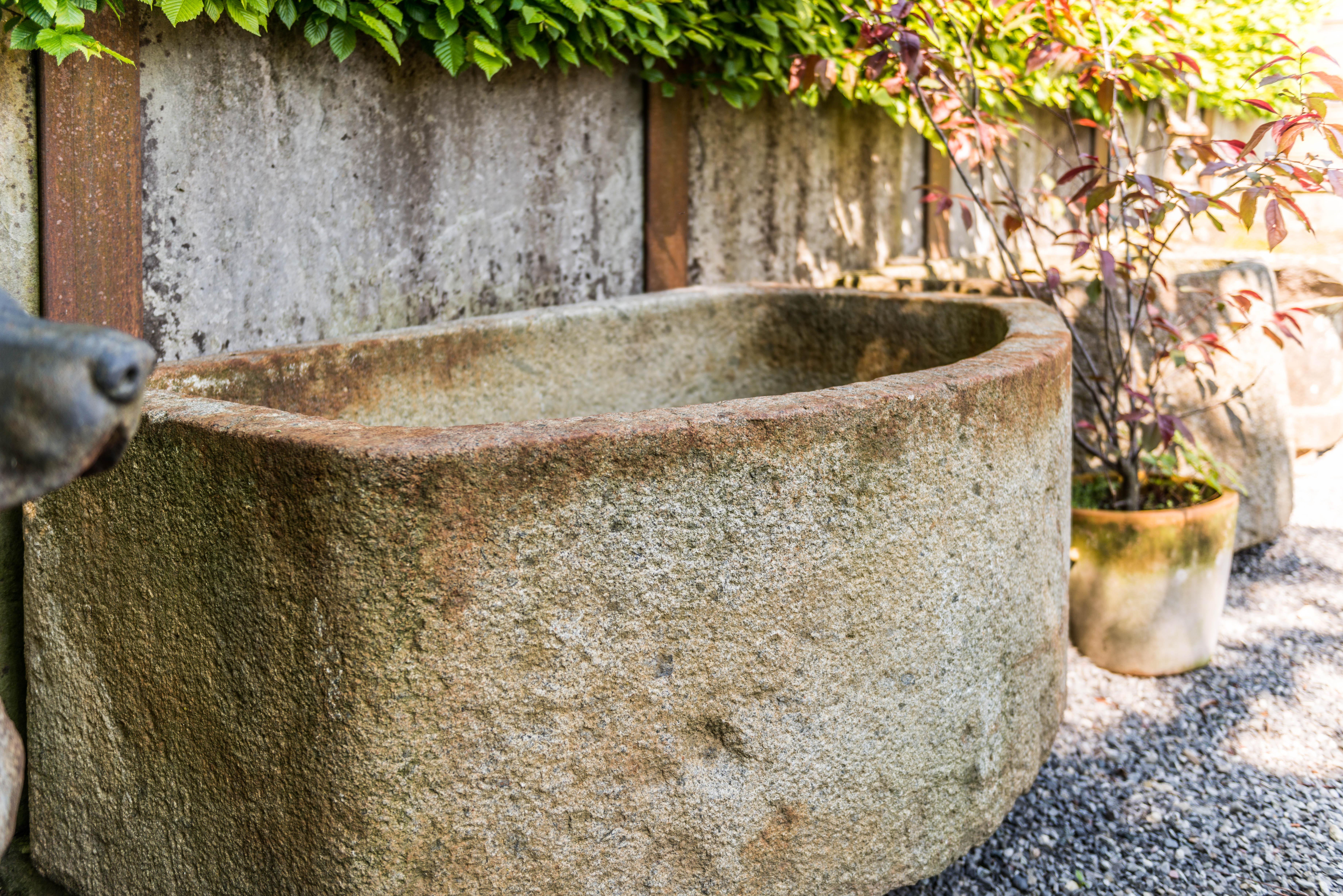 This granite well can be used to put on a wall. The well is in a nice shape and in a good condition. 
The well looks nice in a garden or also in a small town. The place of origin is in France.