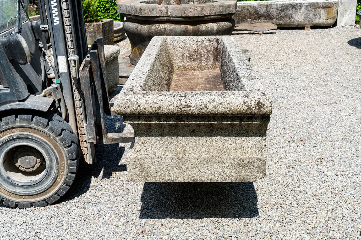 This is a very nice granite well from Italy, Como. The shape is special and the well is dated with old numbers on the front. 1884. It is a very hard granite, a wonderful handwork 19th century. The spouter is 19th century as well.
  