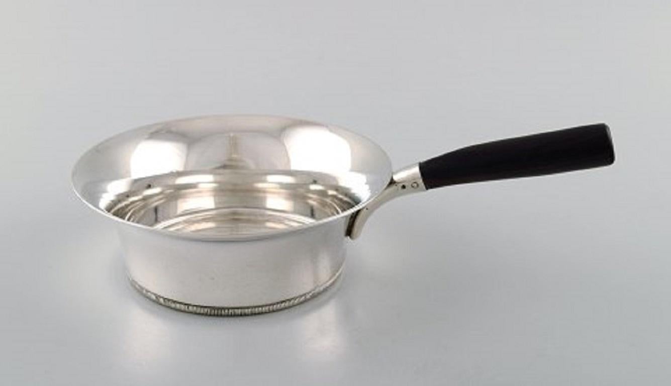 Grann & Laglye. Danish silversmith. Art Deco saucepan in silver 830, with ebony handle. Dated 1938.
Measures: 23 x 7.5 cm.
Stamped.
In very good condition.