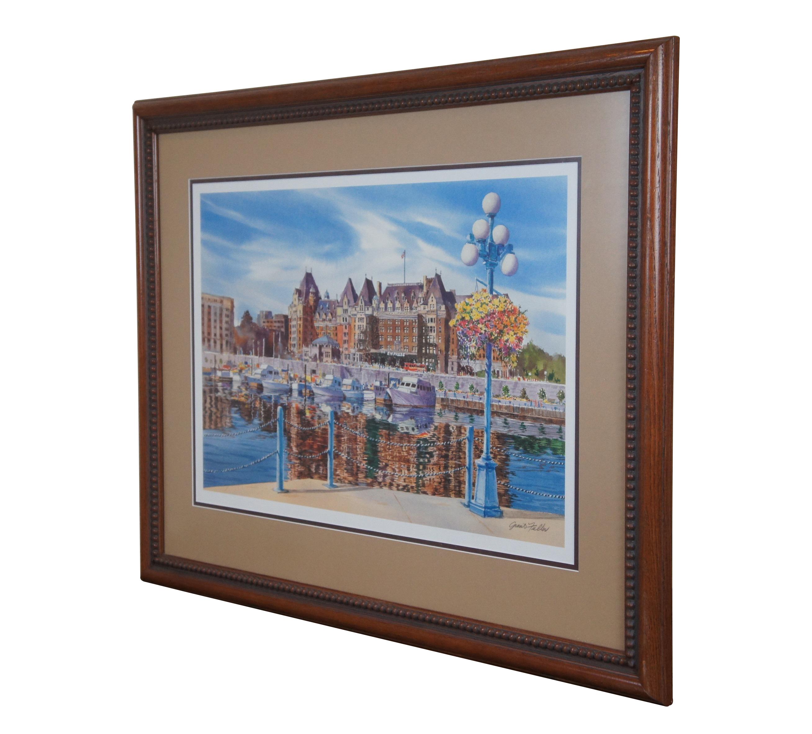 Vintage print by Grant Fuller, showing a view of The Empress Hotel of Victoria, British Columbia, Canada. Signed in plate. Light and dark brown layered mat; rounded wood frame with carved beaded detail.

