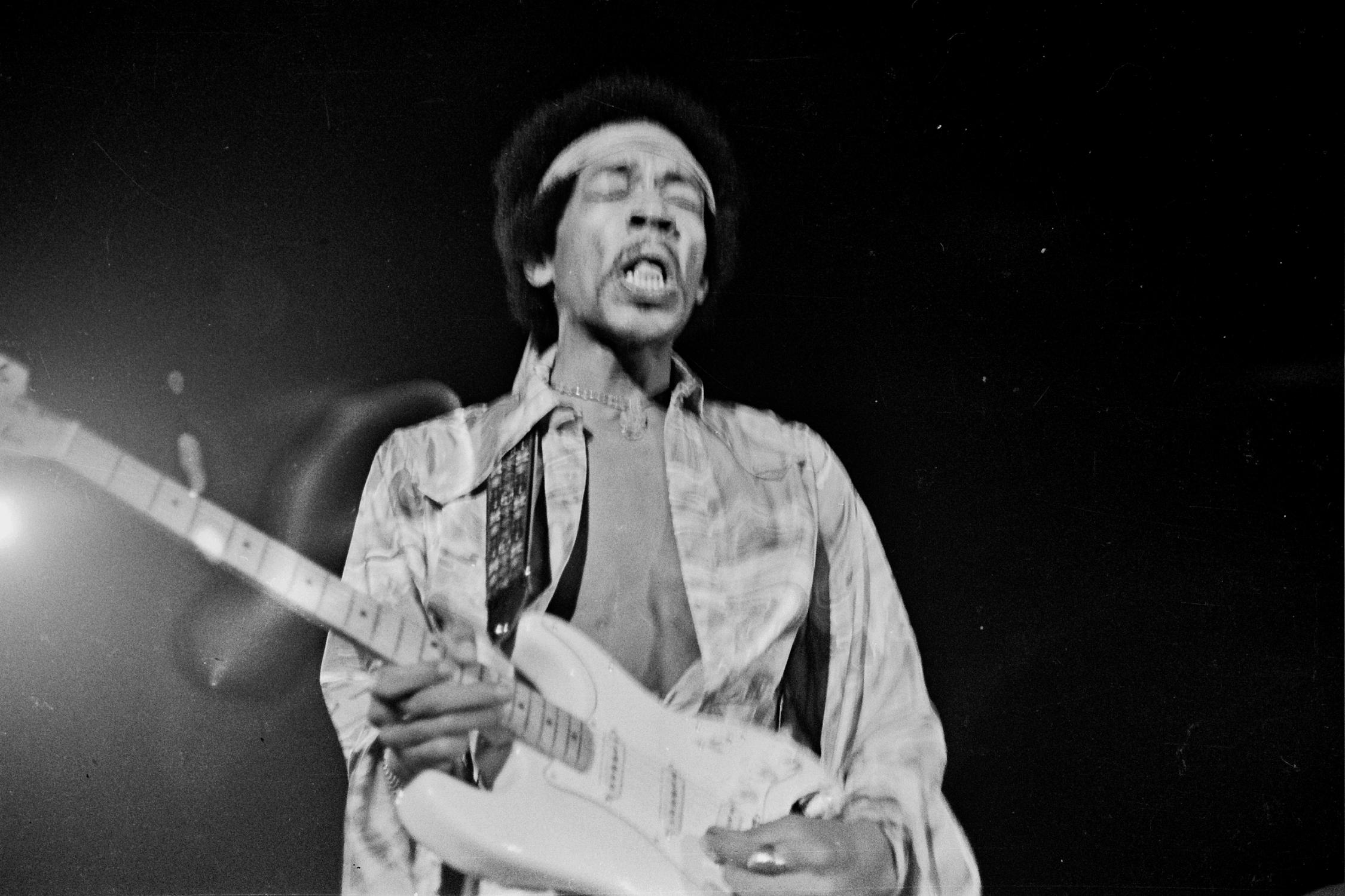 Grant Harper Reid Black and White Photograph - Jimi Hendrix in Action on Stage Fine Art Print
