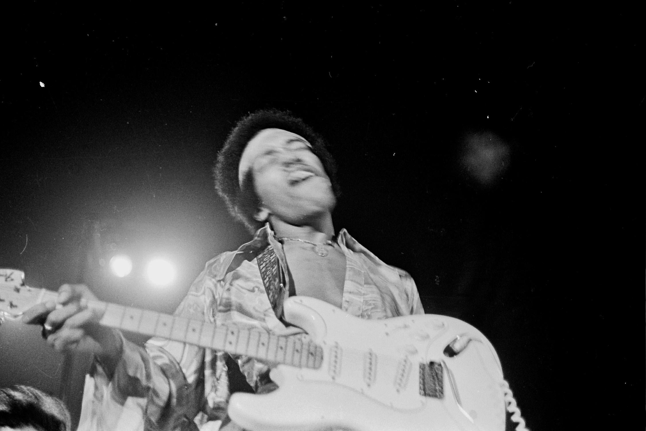 Grant Harper Reid Portrait Photograph - Jimi Hendrix in Action While Performing in Harlem Fine Art Print