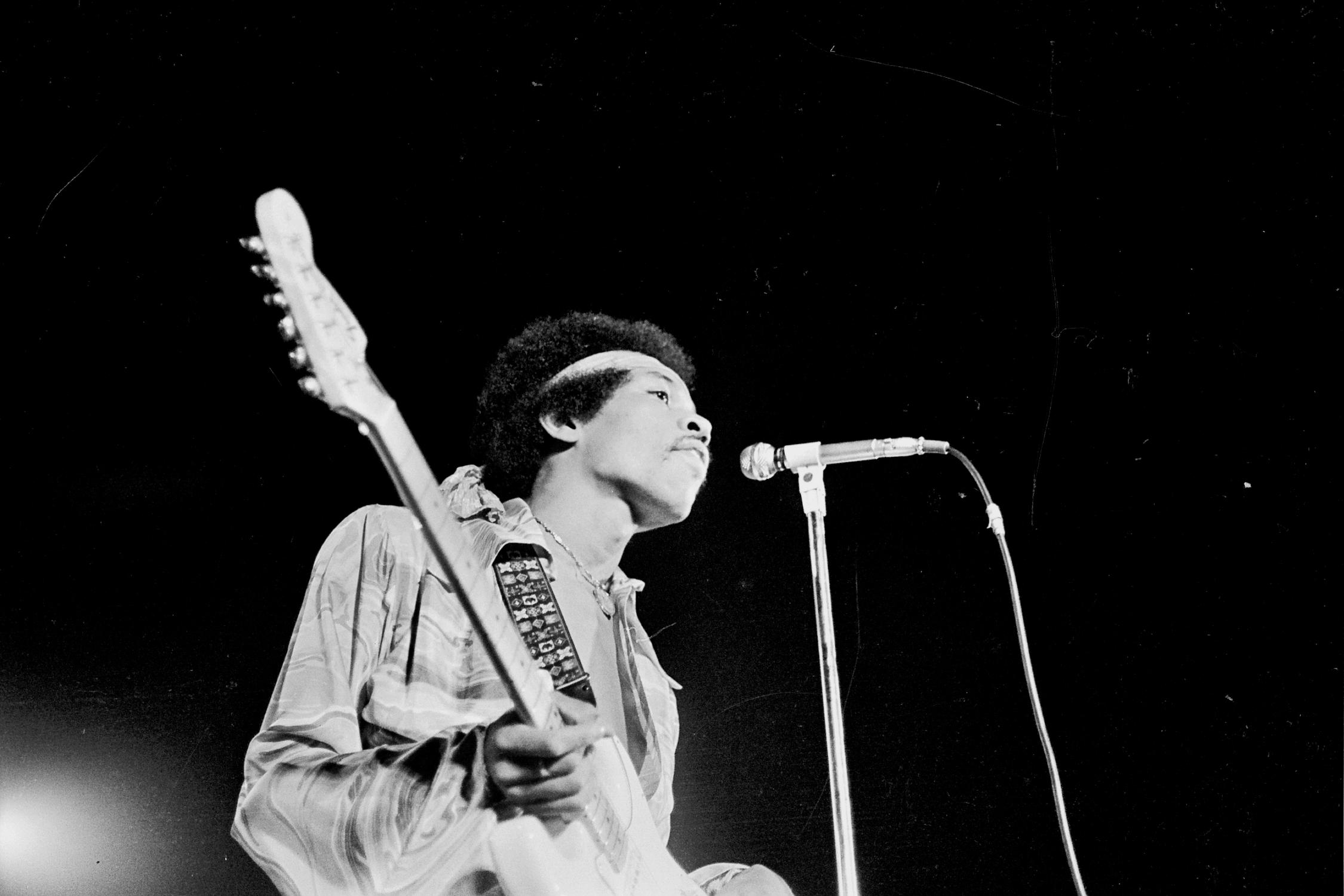 Grant Harper Reid Black and White Photograph - Jimi Hendrix Looking at Harlem Audience Fine Art Print