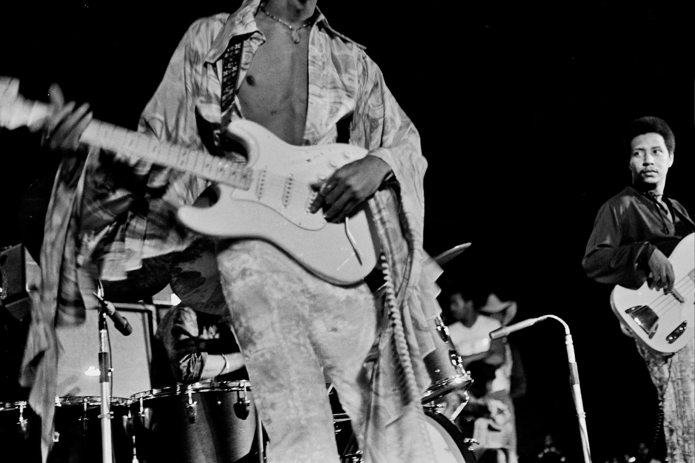 Grant Harper Reid Portrait Photograph - Jimi Hendrix Playing Guitar, Shirt Open Fine Art Print