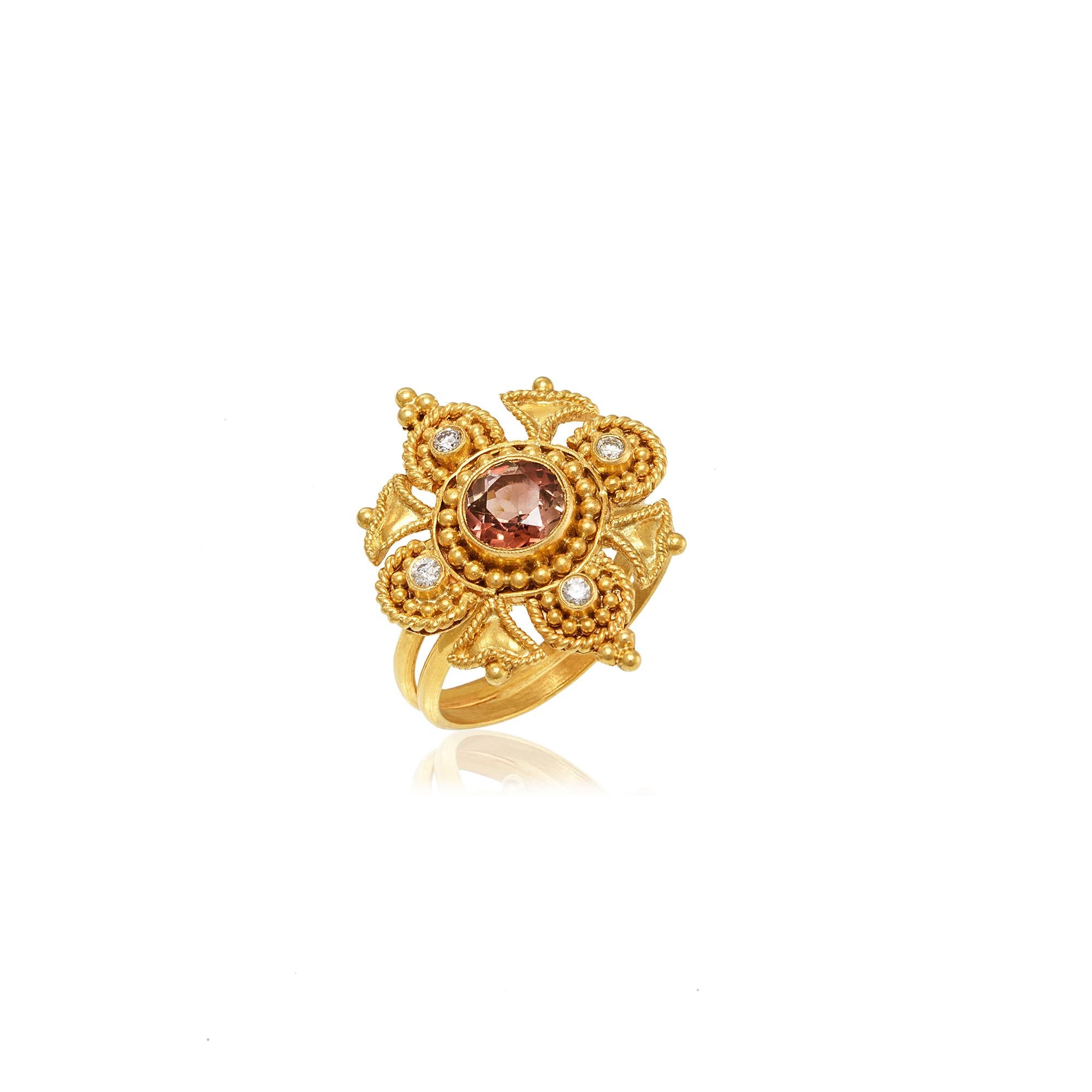 Flower shape Byzantine ring handcrafted in 22Kt yellow gold, featuring a Tourmaline center and a brilliant cut diamond in each petal. This breathtaking ring is created using the traditional techniques of filigree and granulation. Minute gold beads