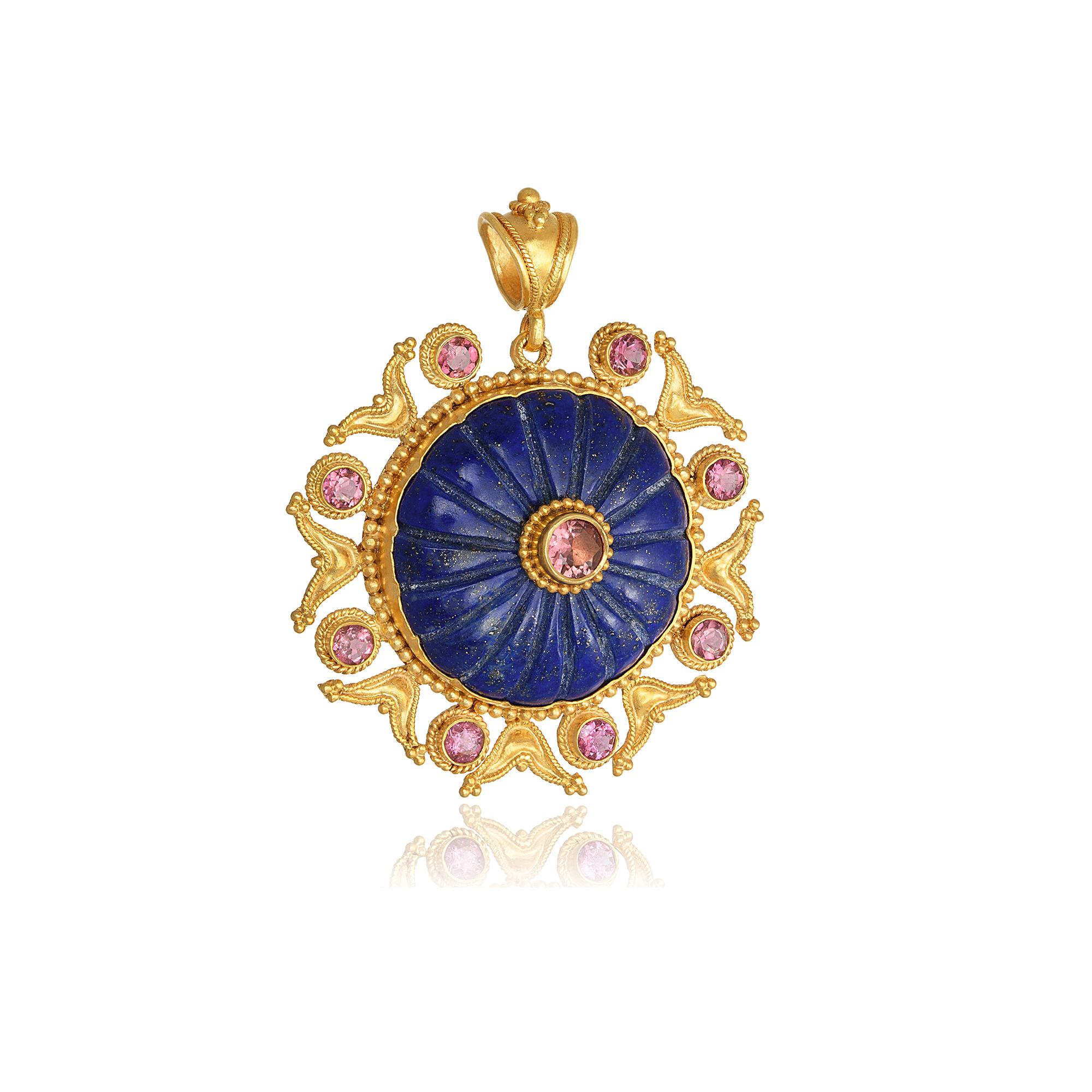 Granulation round flower shape pendant handcrafted in 22Kt yellow gold, featuring a hand carved Lapis Lazuli center and Tourmalines around it. This One-Of-A-Kind Pendant is created using the traditional techniques of granulation and filigree. These