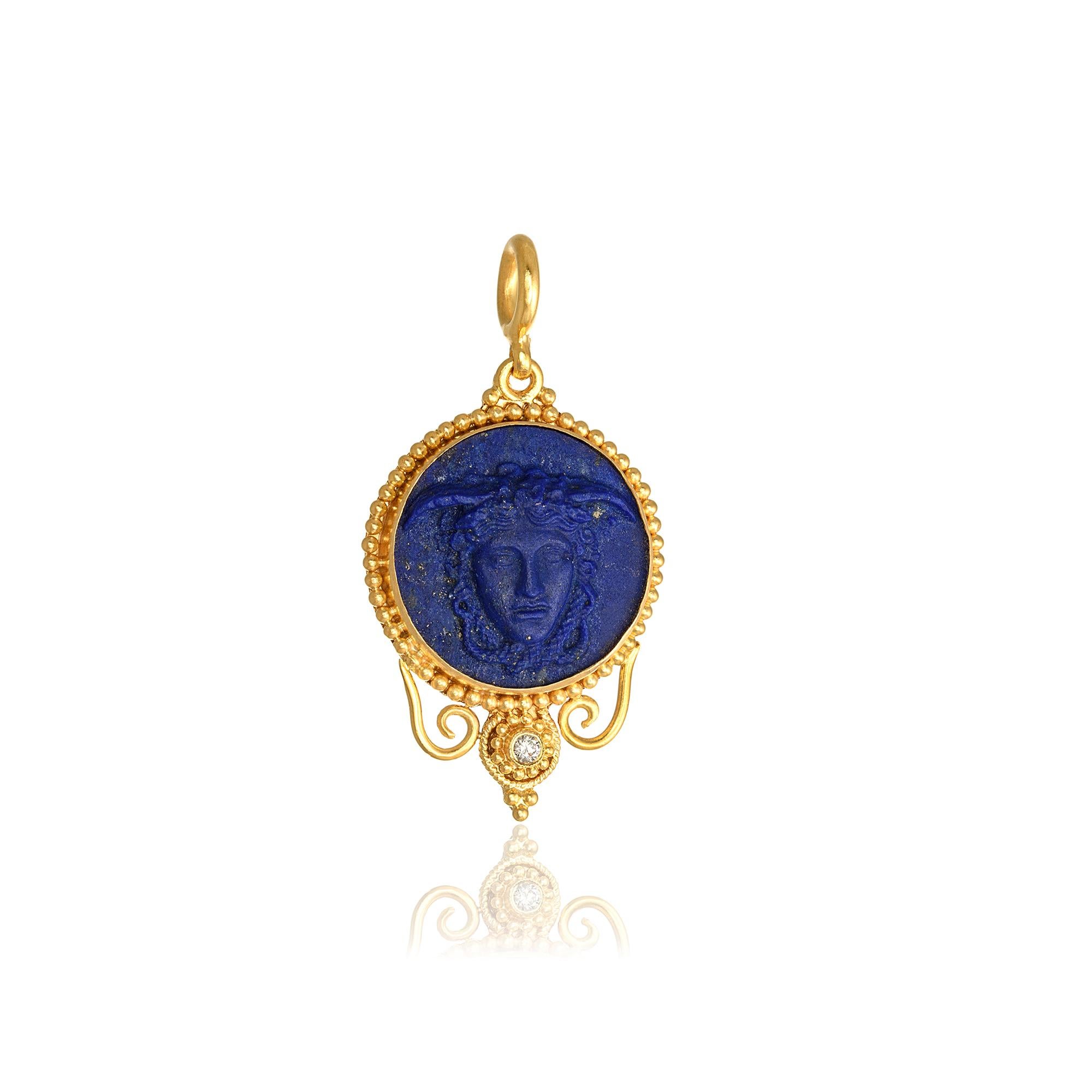 Medusa Head round Pendant handcrafted in 22Kt yellow gold, featuring a carved Lapis Lazuli center and a brilliant cut diamond. Inspired by the ancient greek mythology and Perseus's accomplishments, Nicofilimon created this jewelry masterpiece