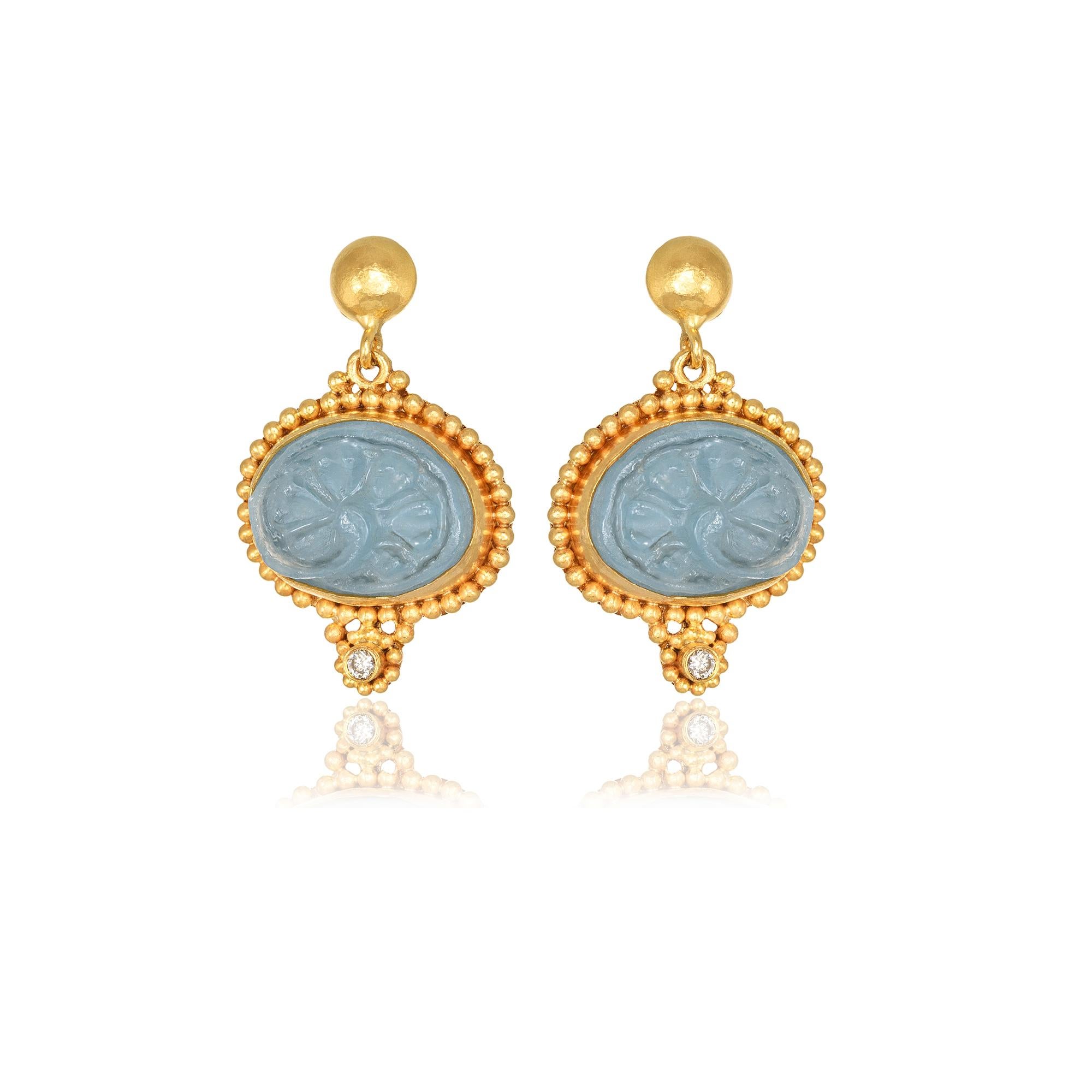 Oval drop earrings handcrafted in 22Kt yellow gold, featuring a carved Aquamarine and brilliant cut diamonds. This One-Of-A-Kind pair of earrings is created using the traditional techniqus of hand hammering and granulation. The minute gold beads are