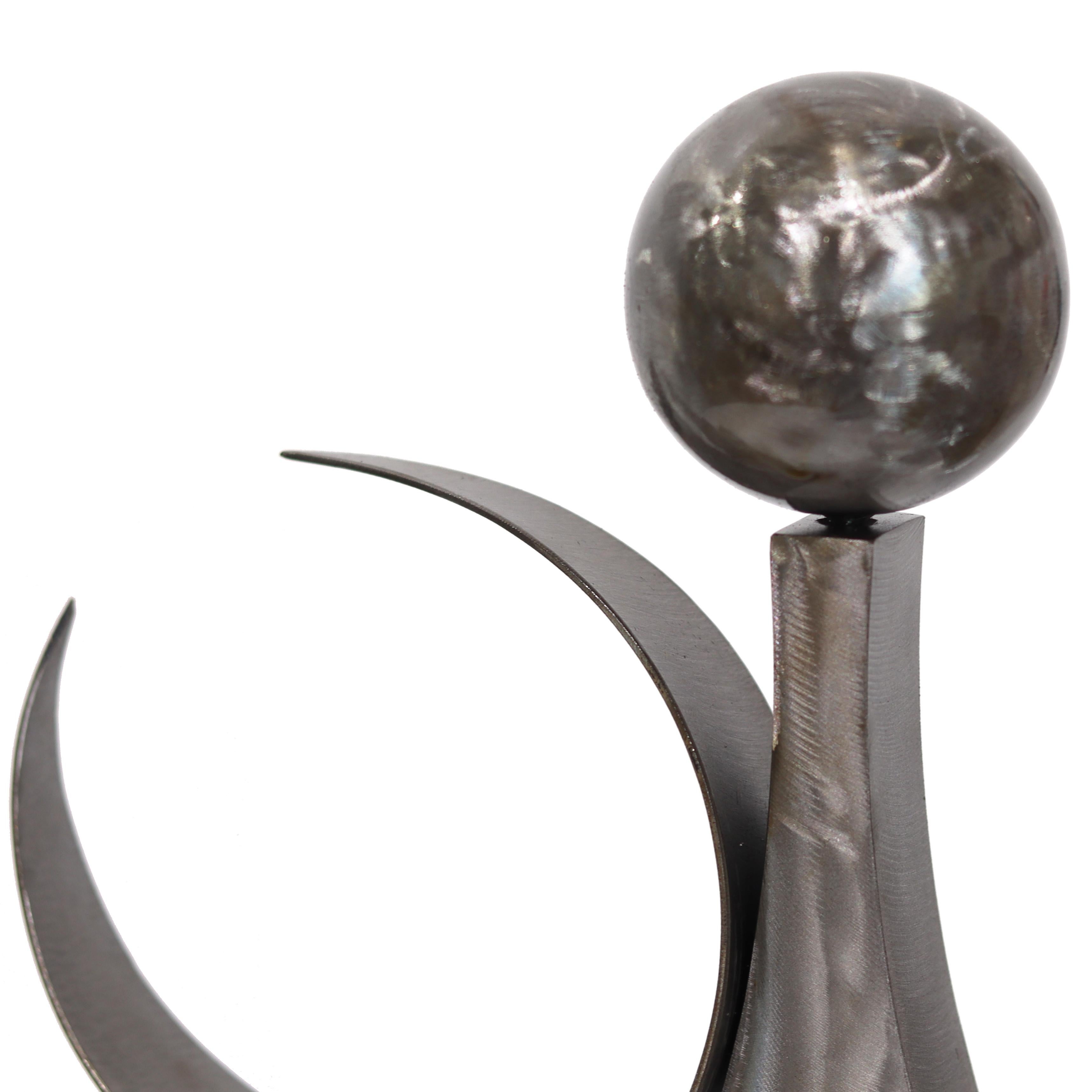 Inspired by dance and weightlessness, Granville Beals' industrial metal sculptures are primarily about relationships. Concerned with form and abstraction, he does not merely manipulate metals to defy the expectation of the medium forms, but explores