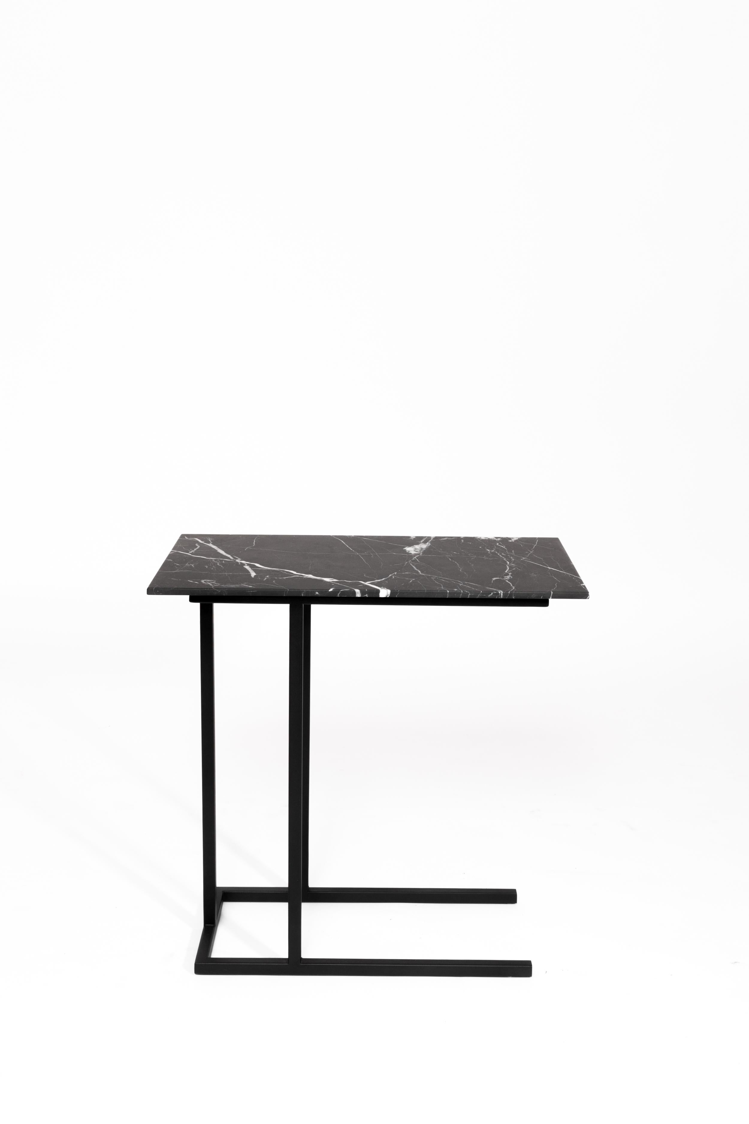 Highly functionalist, the Grapa Side Table is made up of a steel structure in electrostatic paint and covered in matte finish marble. It perceives as a light-handed piece inspired by the rationalist furniture of the 20th century.  Production time: