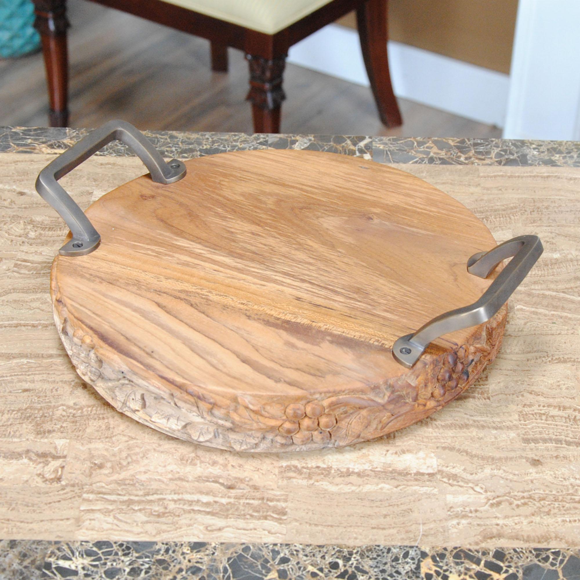From Niagara Furniture, this Grape Carved Teak Serving Platter with Handles is produced from solid teak wood and solid brass.  Decorative and beautiful hand carved grape motif accentuates the amazing Teak wood, ideal for serving up some crackers and