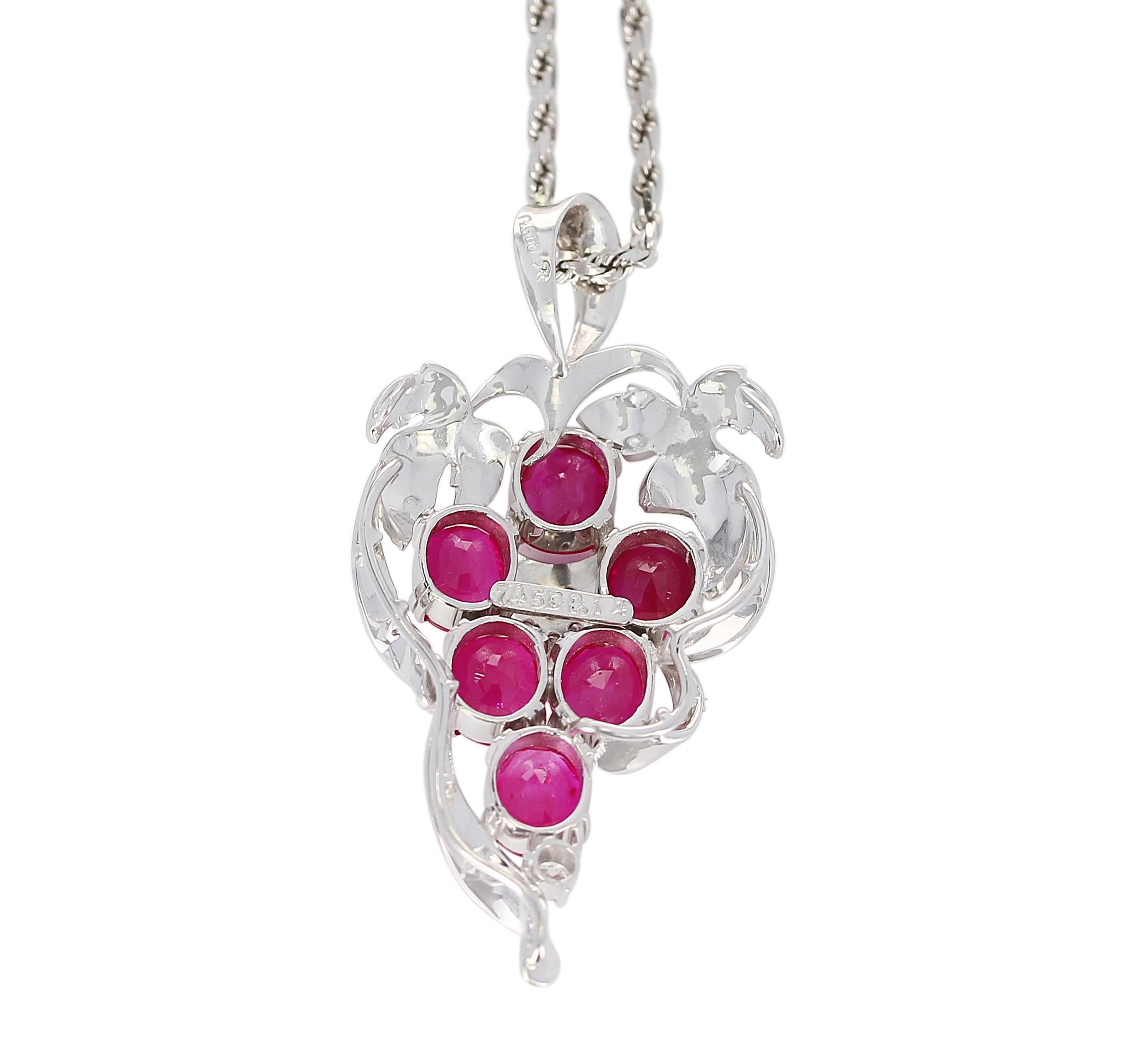 Grape-Style Ruby Pendant with Diamonds in Platinum and 18K White Gold. The six ruby stones weigh 7.45 carats, and the diamonds weigh 0.14 carats. With chain, Total Weight: 22.50 grams.  