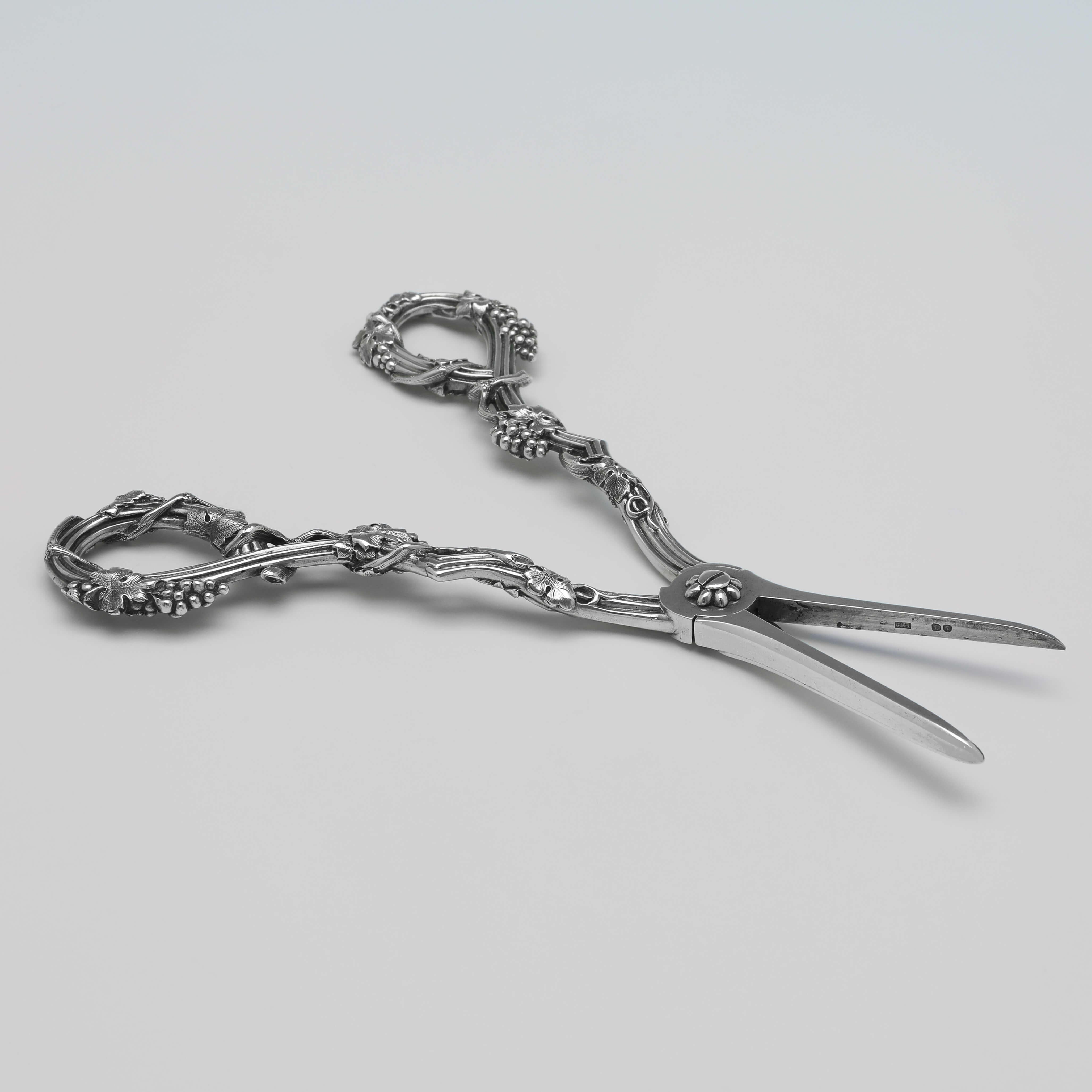 Hallmarked in London in 1850 by Francis Higgins, this attractive pair of Victorian, Antique Sterling Silver Grape Shears, feature grape and vine detailed handles.

The grape shears measure 7.25