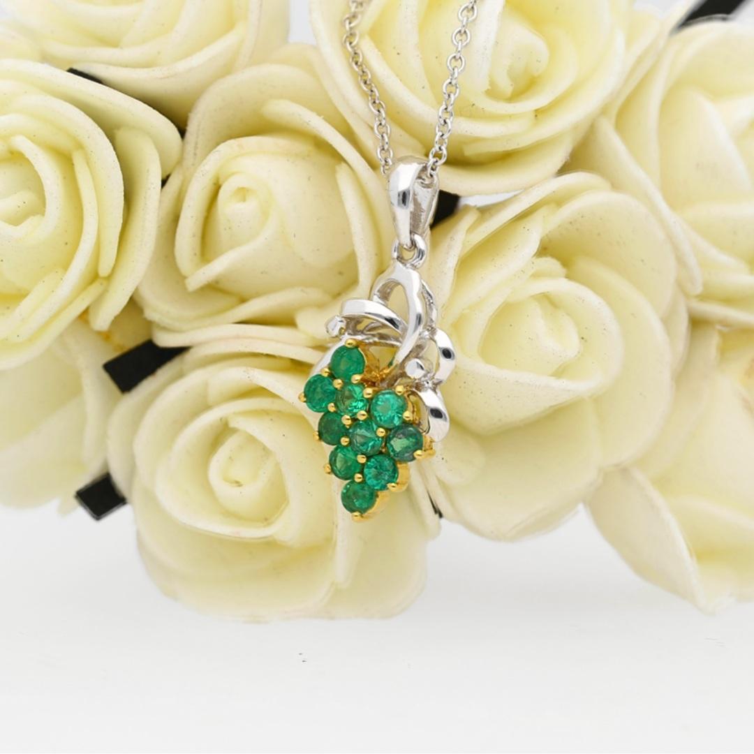 This item is made to order.

Floral Grapevine Motif Natural Emerald and Diamond Pendant Necklace in 18K Gold. Stationed on a 2mm, 18-inch cable chain. Available in yellow gold, white gold and rose gold.

✔ Type: Pendant Necklace
✔ 10 Emeralds
✔ Gold