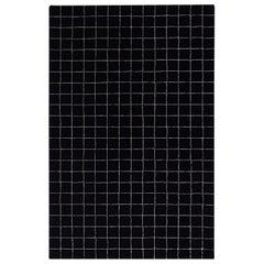 Schwarz-weiß karierter Wollteppich mit Graphmuster 5x8