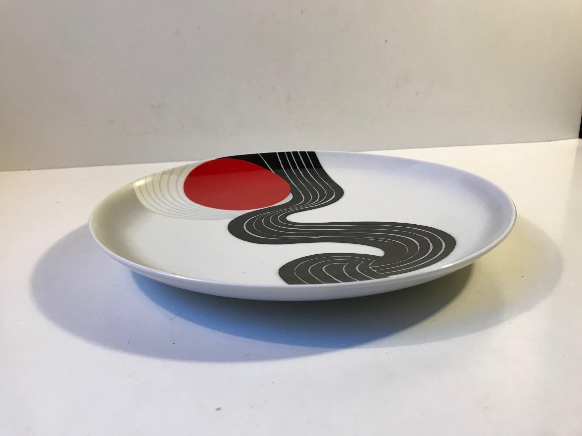 Wall hung porcelain plaque or dish with motif designed by Indian Graphic designer and artist Srivastava Narendra. This plaque is a part of a 600 pieces limited run by German Rosenthal in 1979.