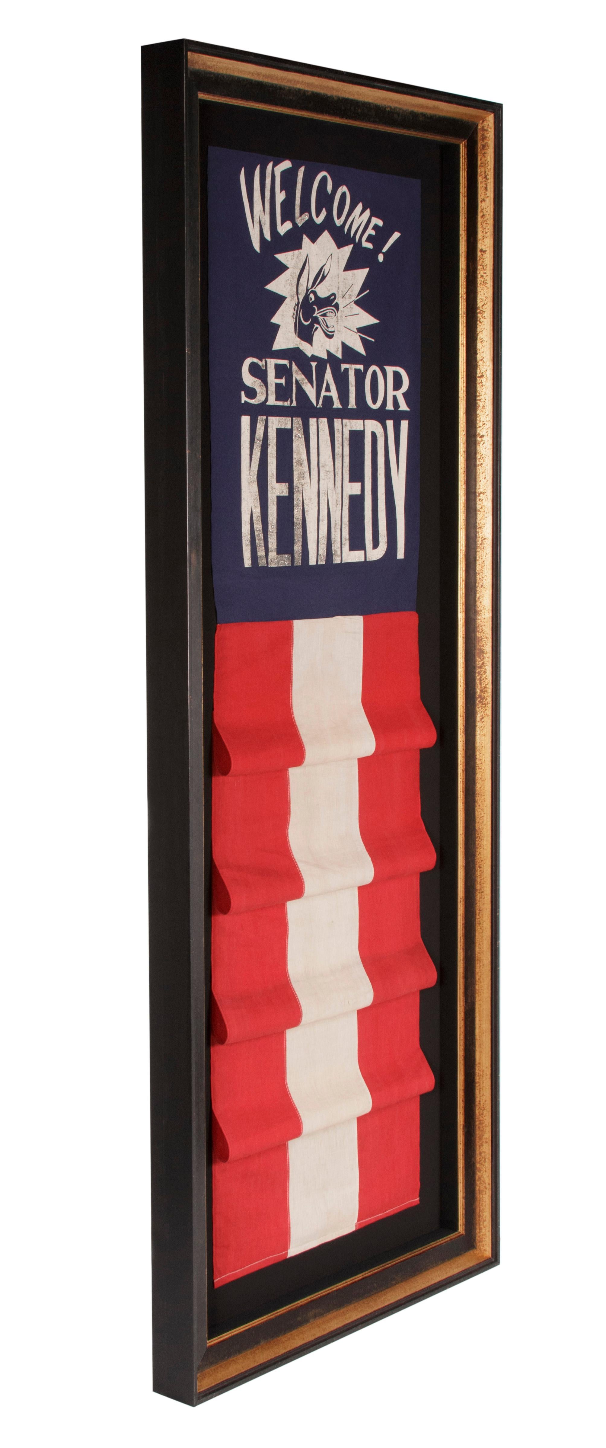 GRAPHIC BANNER WELCOMING JOHN F. KENNEDY AS SENATOR FROM MASSACHUSETTS, WITH NEIGHING DEMOCRAT DONKEY AND GLITTERED LETTERING, 1953-1960, SINGULAR AMONG KNOWN OBJECTS 

Gubernatorial, congressional, and senatorial items for men who became major U.S.