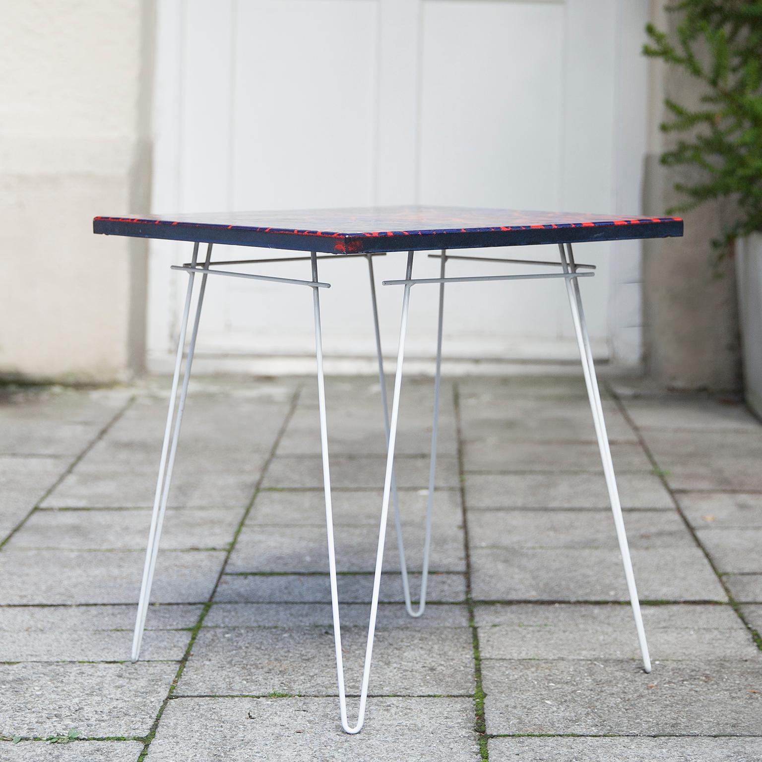 Enamel top side table in fantastic red blue color on an original white lacquered metal base from Germany 1960s.

 